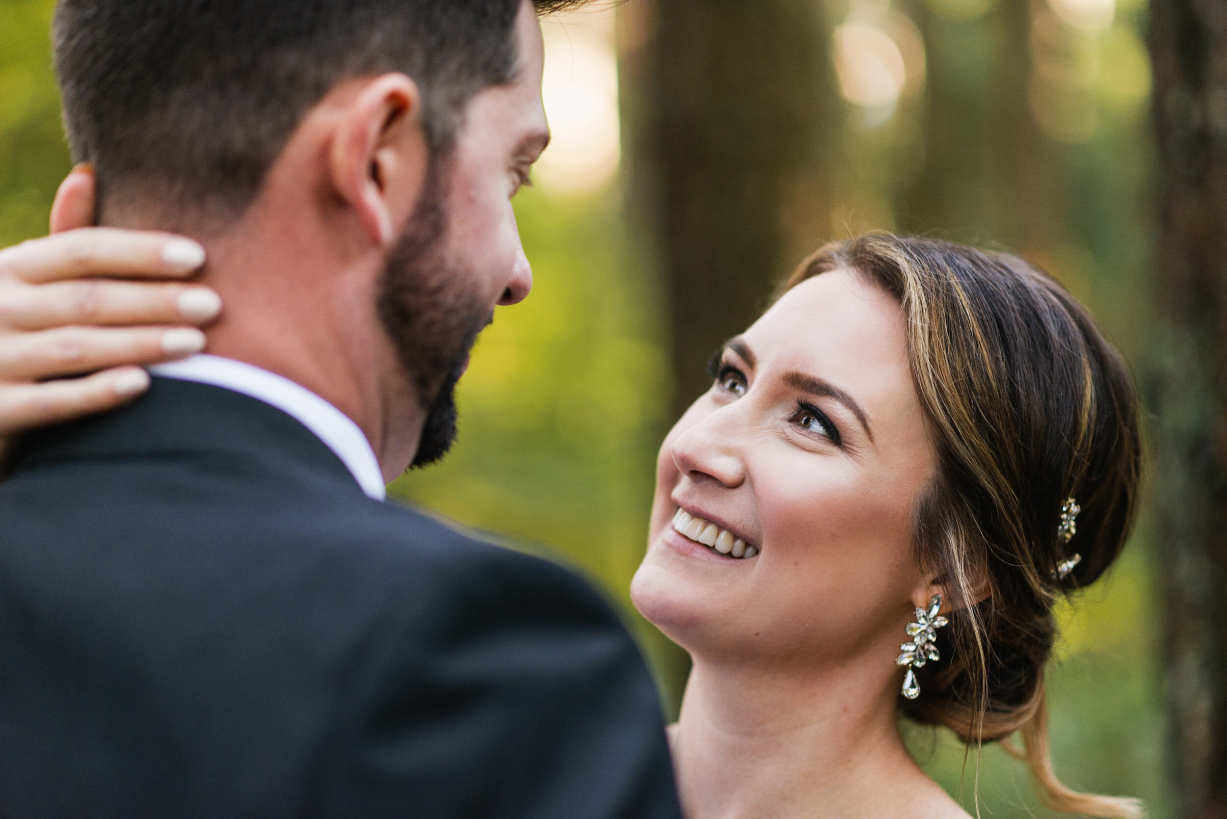 Bride's face embrace Groom