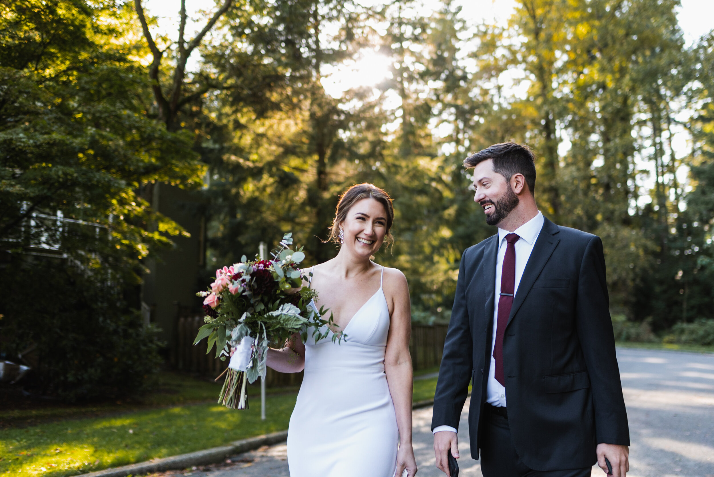 Bride and Groom walking together and laughing