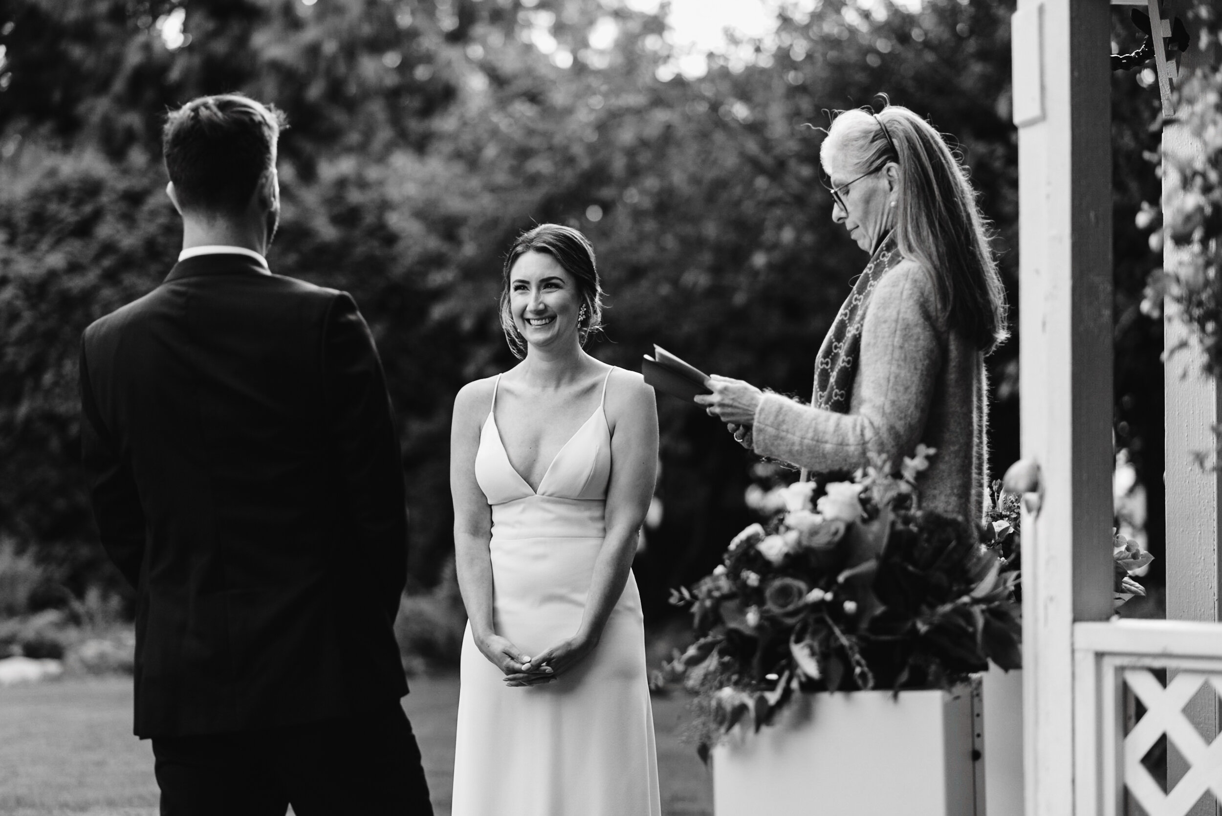 Bride at ceremony black and white