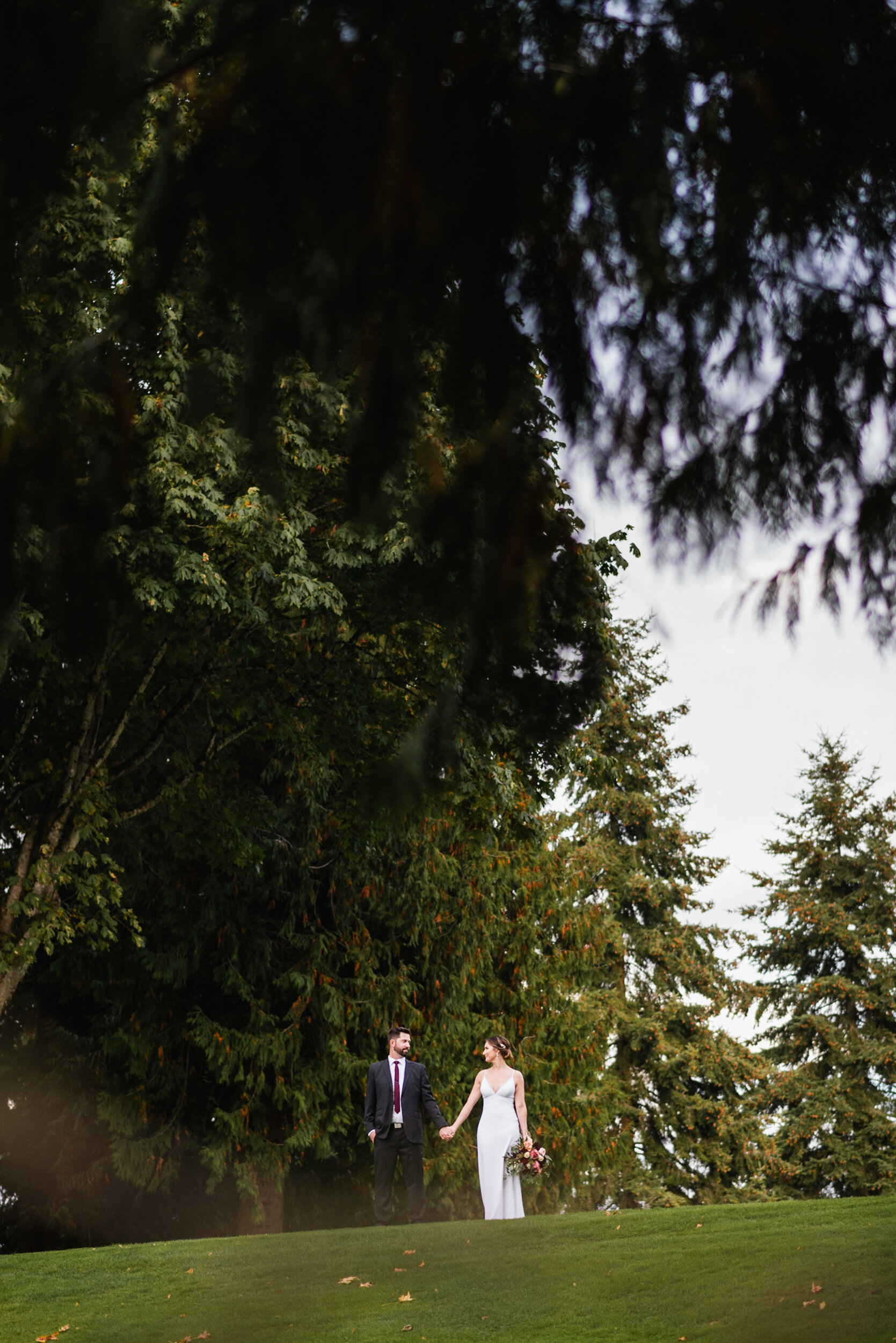 Bride and Groom standing on golf course
