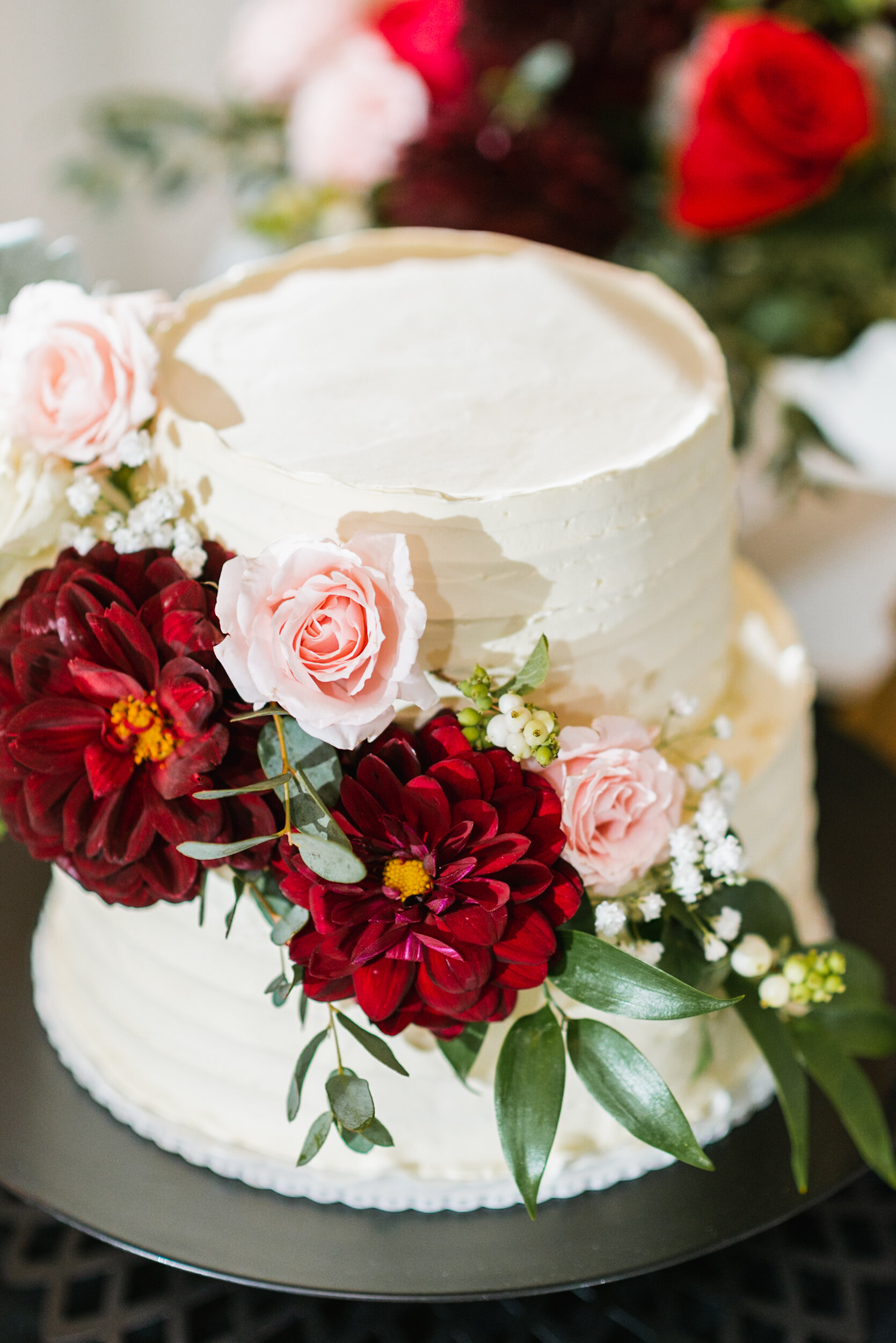 Wedding cake with red flowers