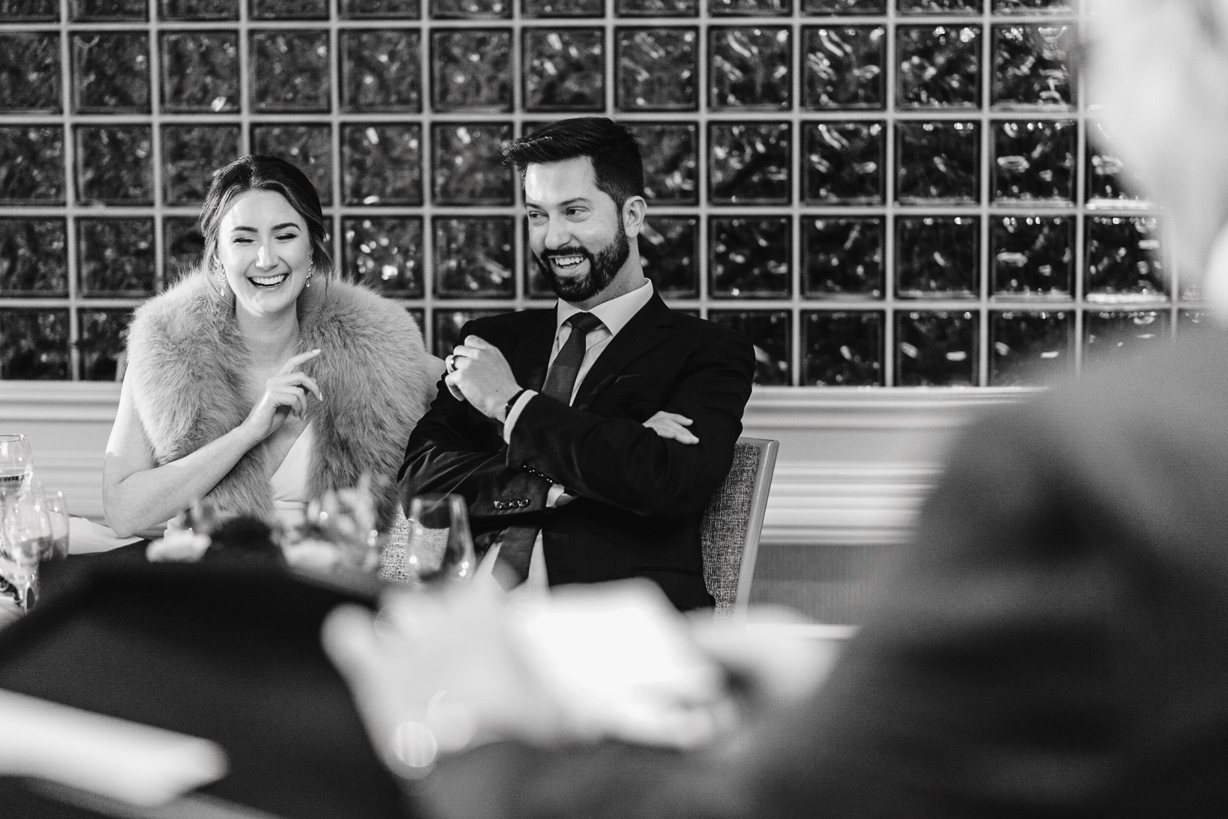 Bride and Groom at head table laughing