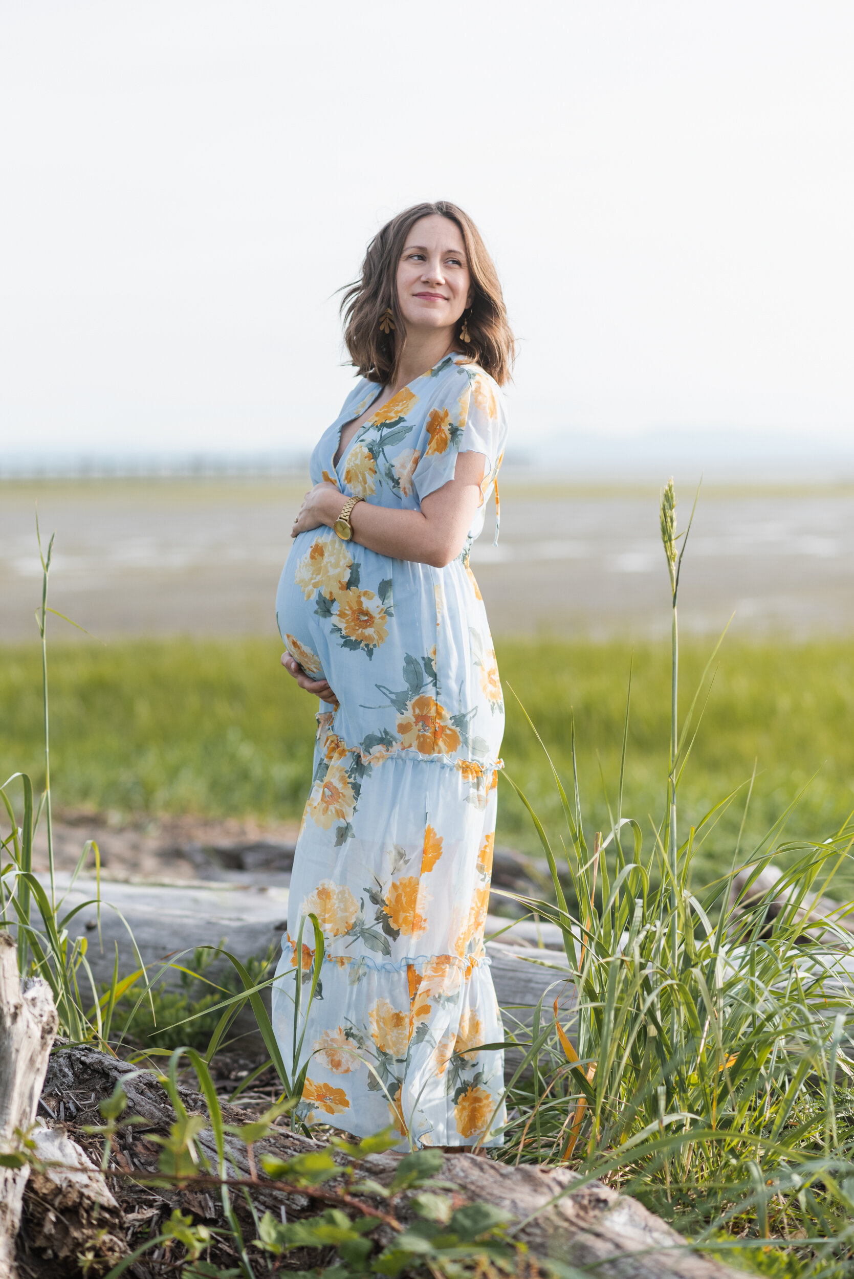 Pregnant woman beach grass