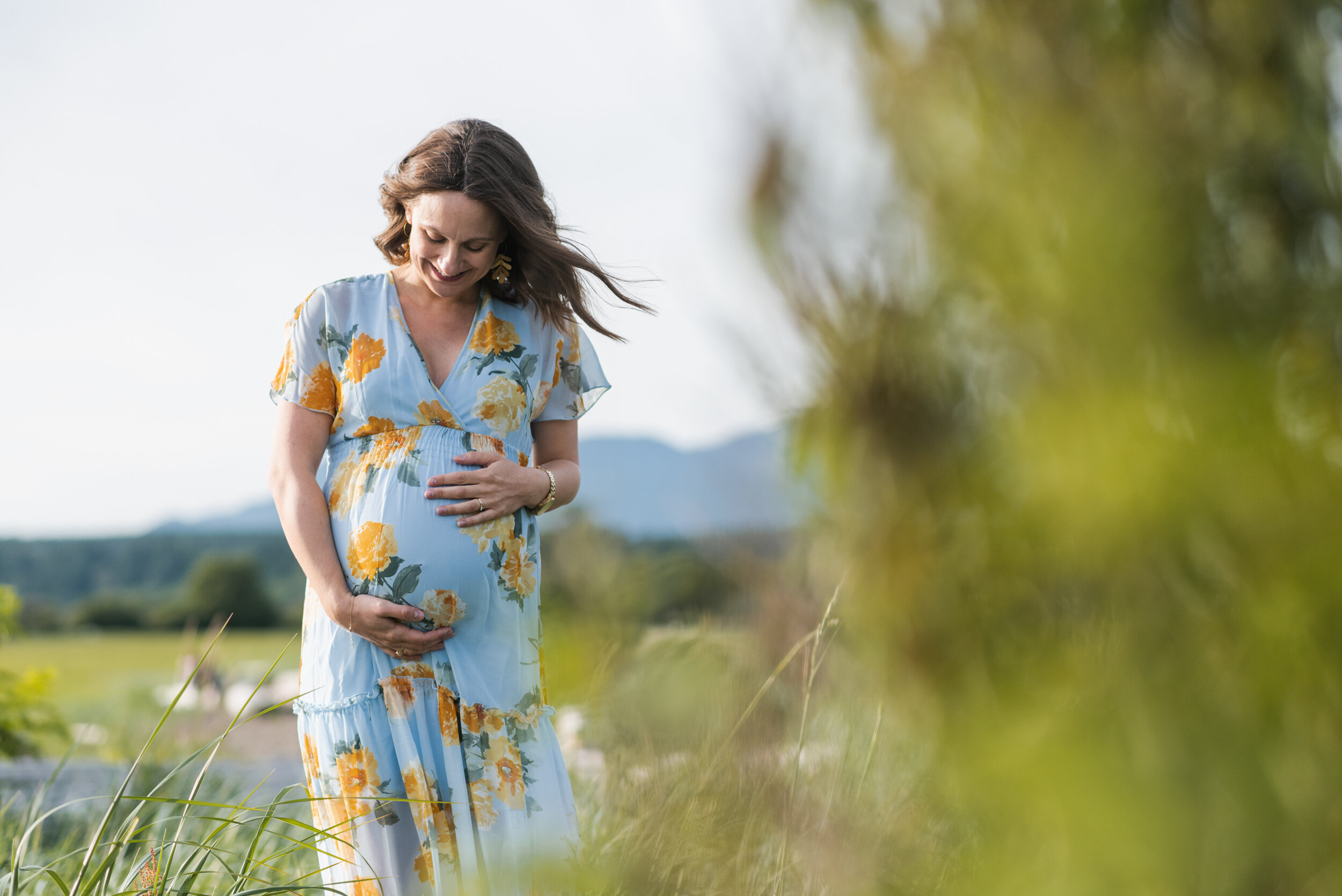 Pregnant woman beach grass