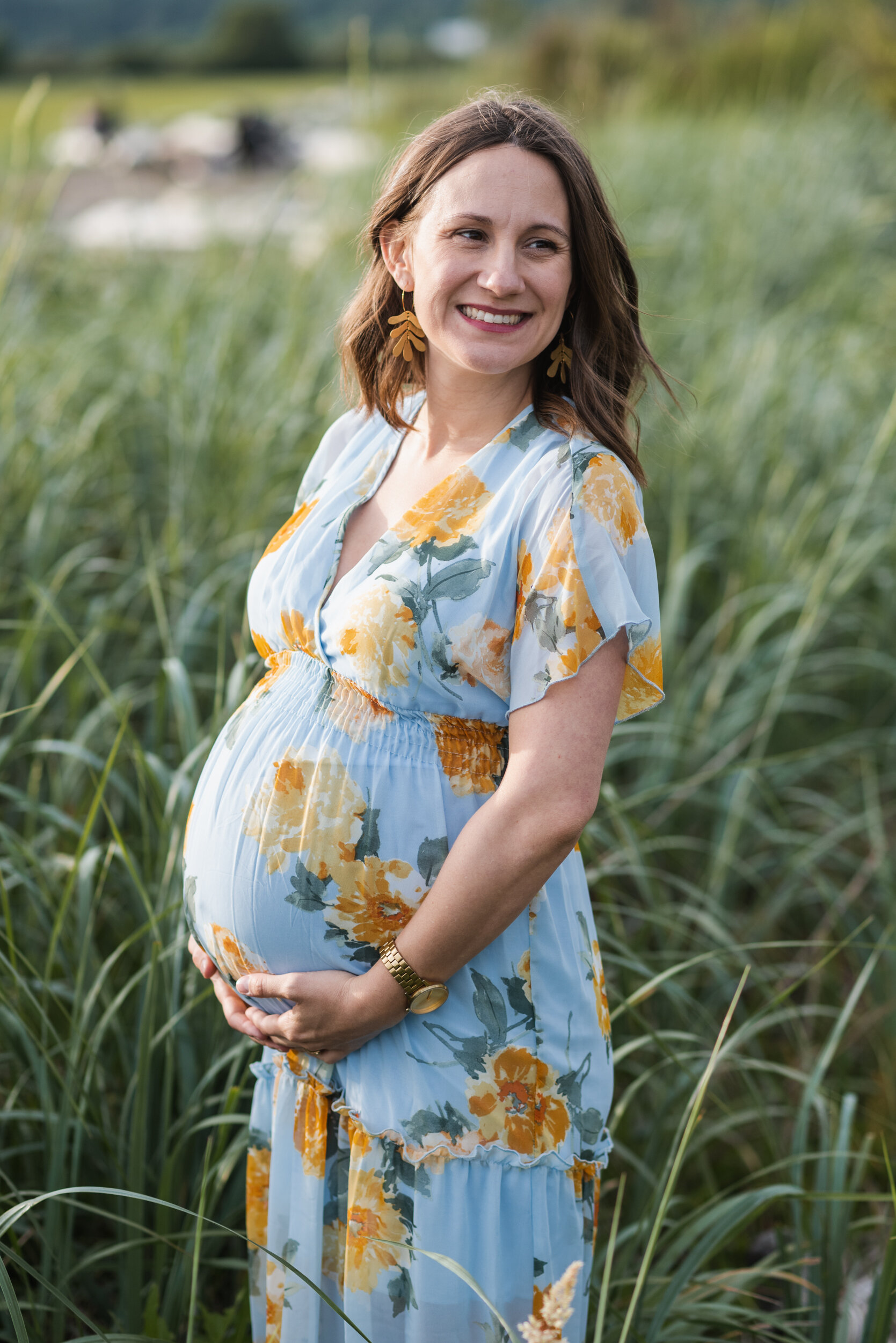 Pregnant woman beach grass