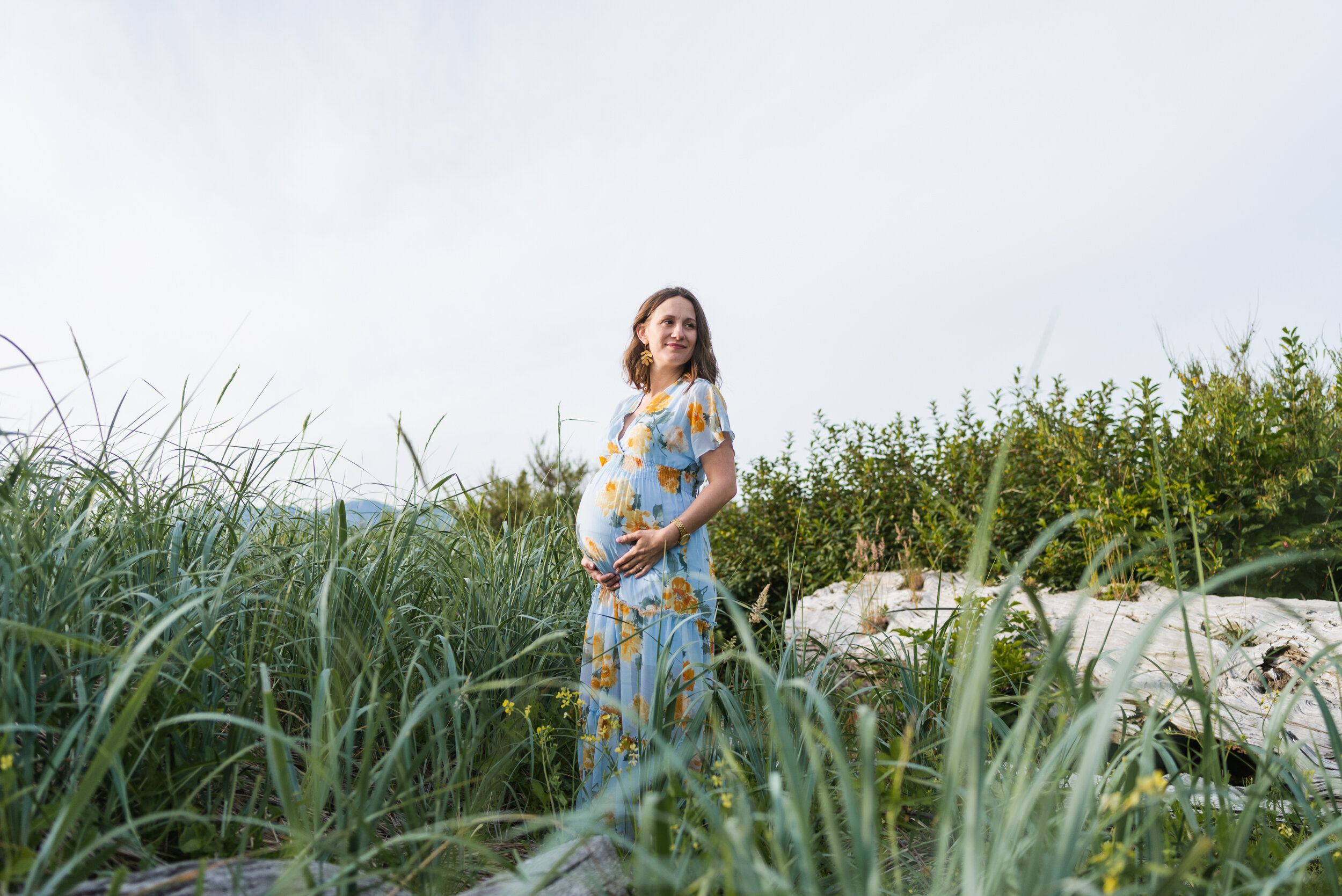 Pregnant woman beach grass