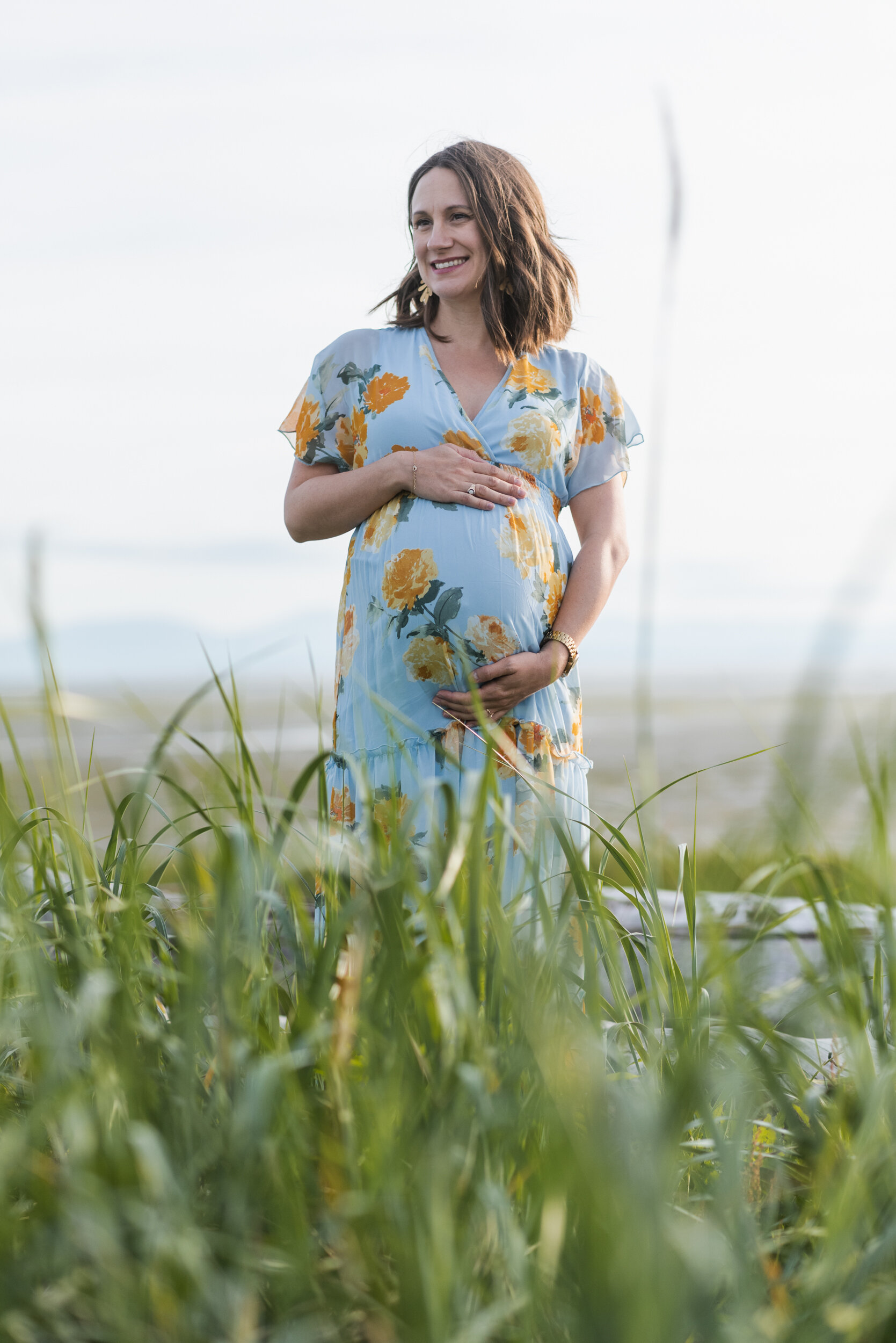 Pregnant woman beach grass