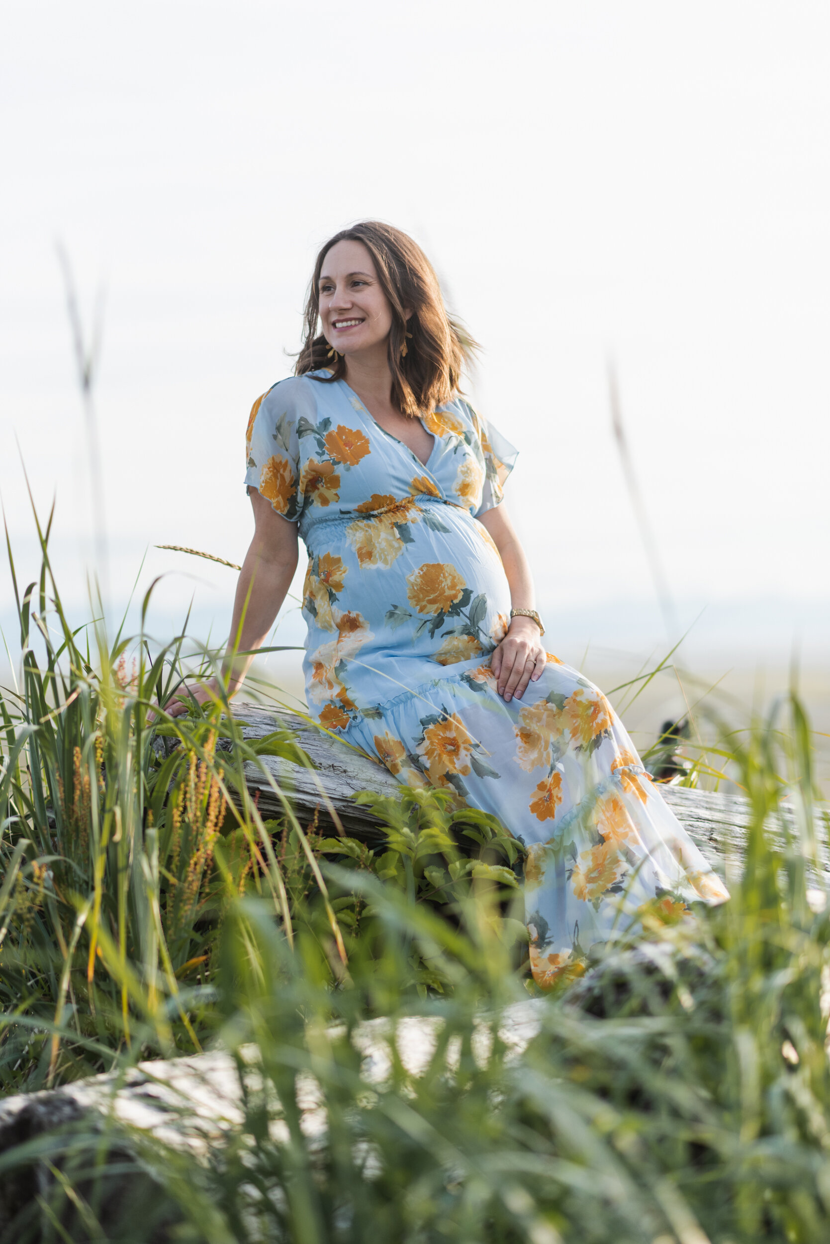 Pregnant woman beach grass