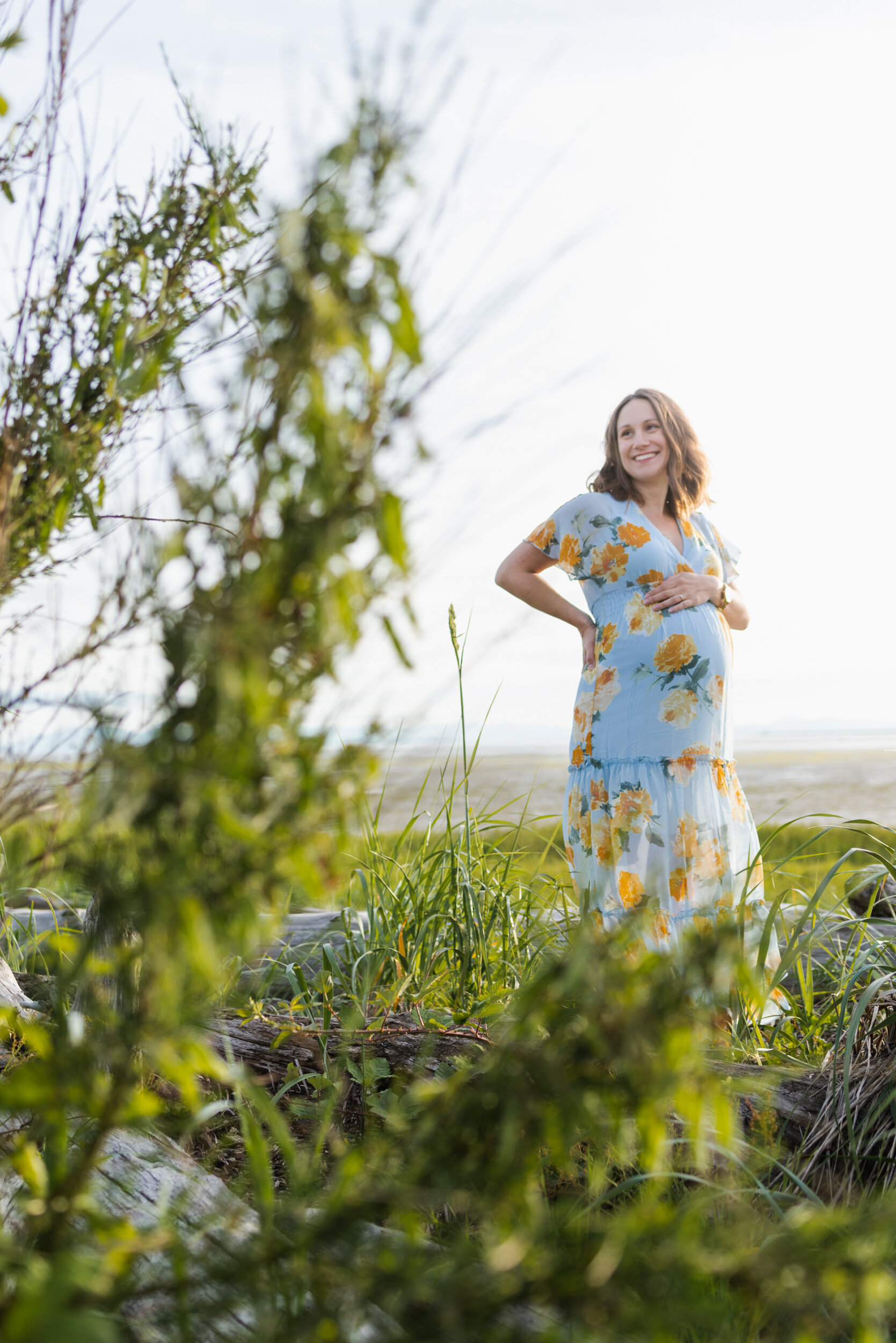 Pregnant woman beach grass