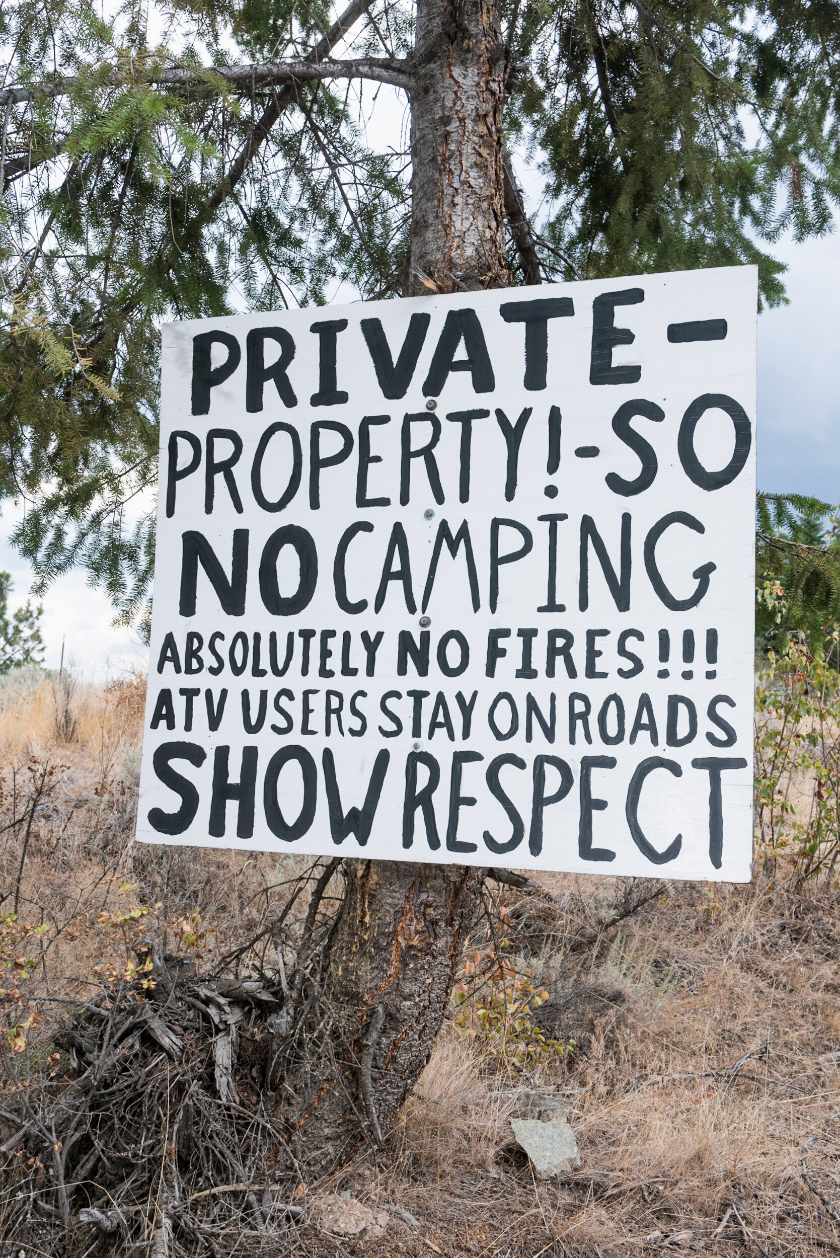 Private property sign in forest