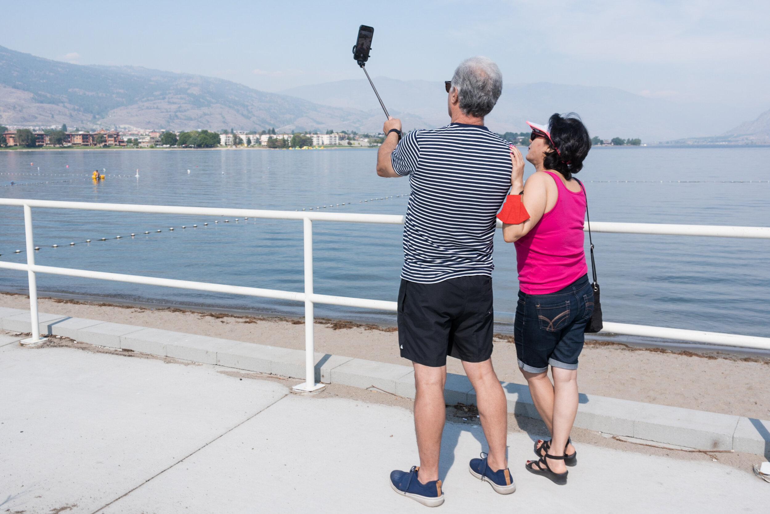 Couple takes selfie by the lake