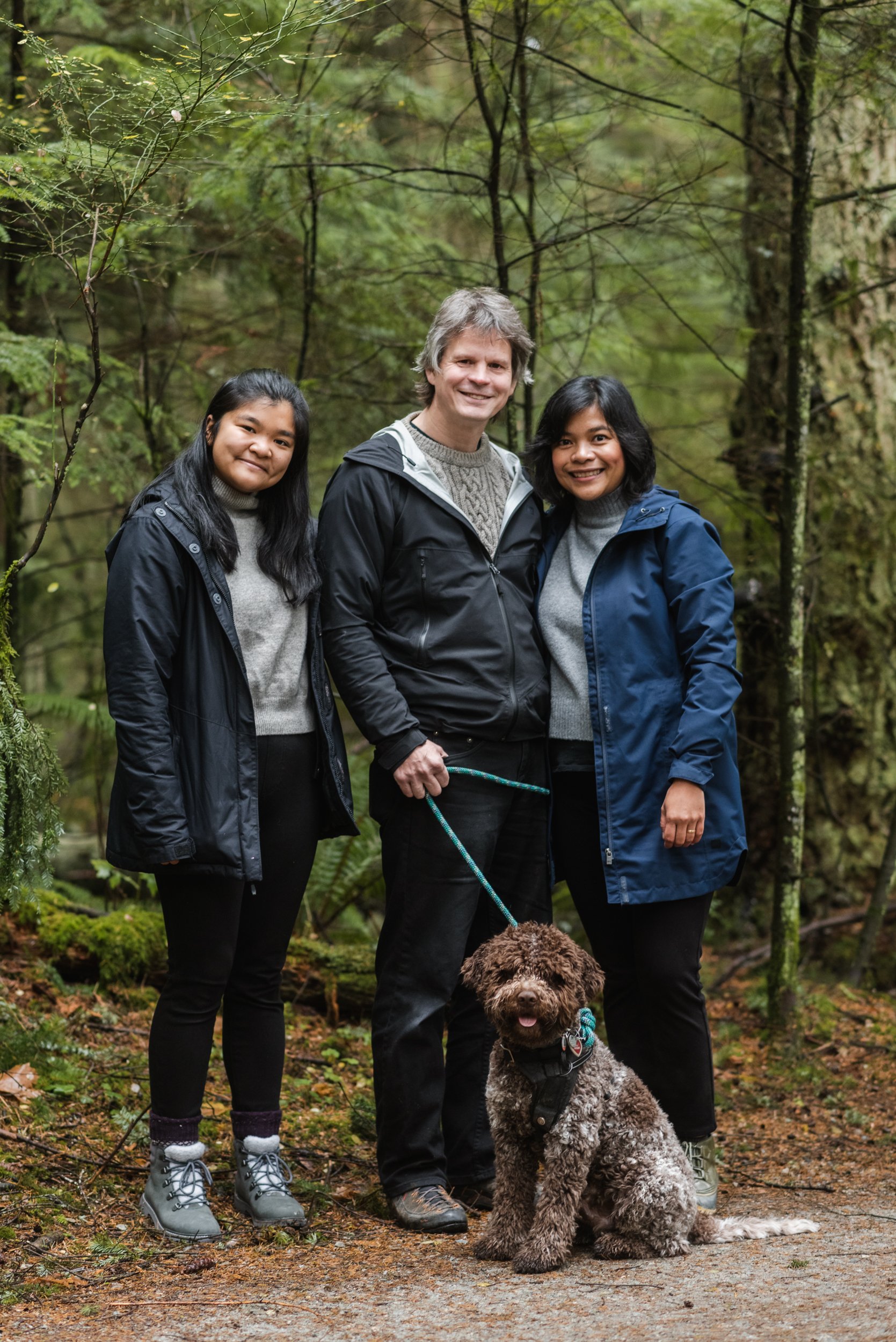 Family in forest with dog