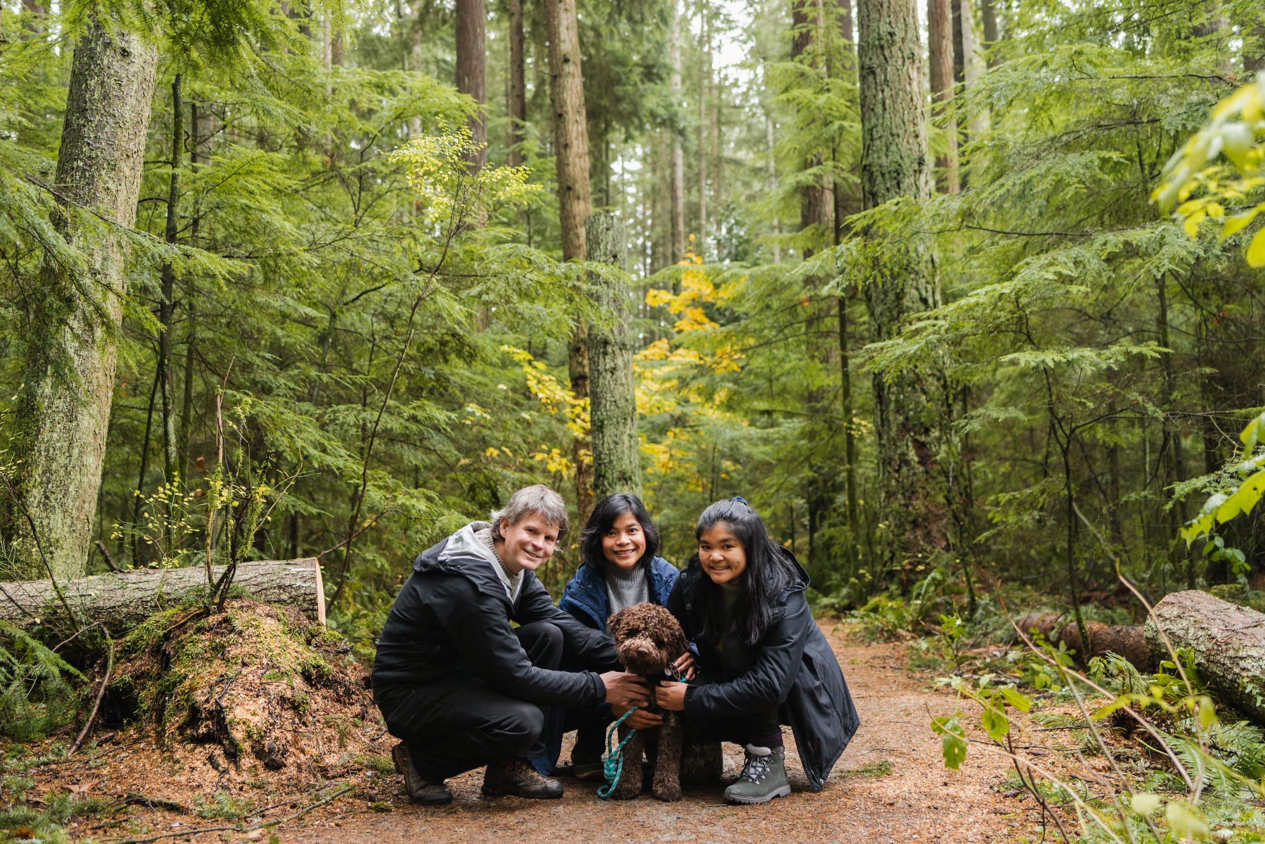 Family in forest with dog