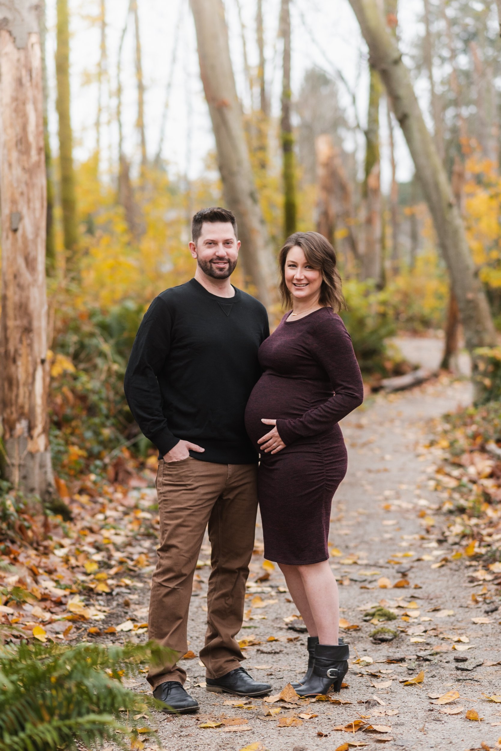 Pregnant woman with husband on forest path