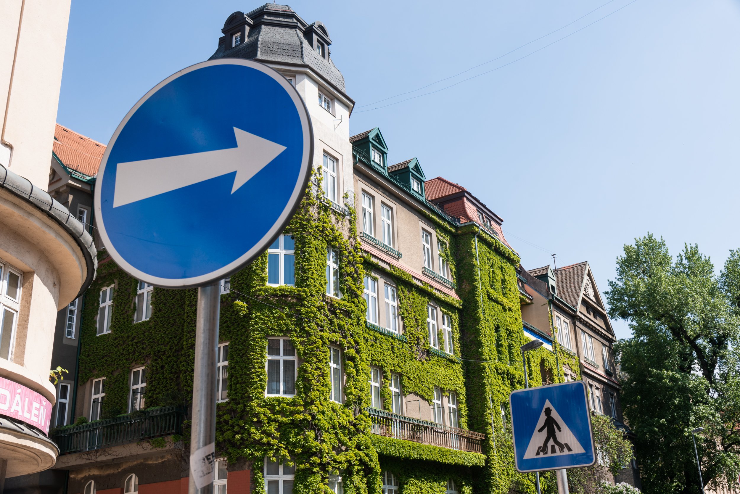 Moss covered building with street sign Bratislava