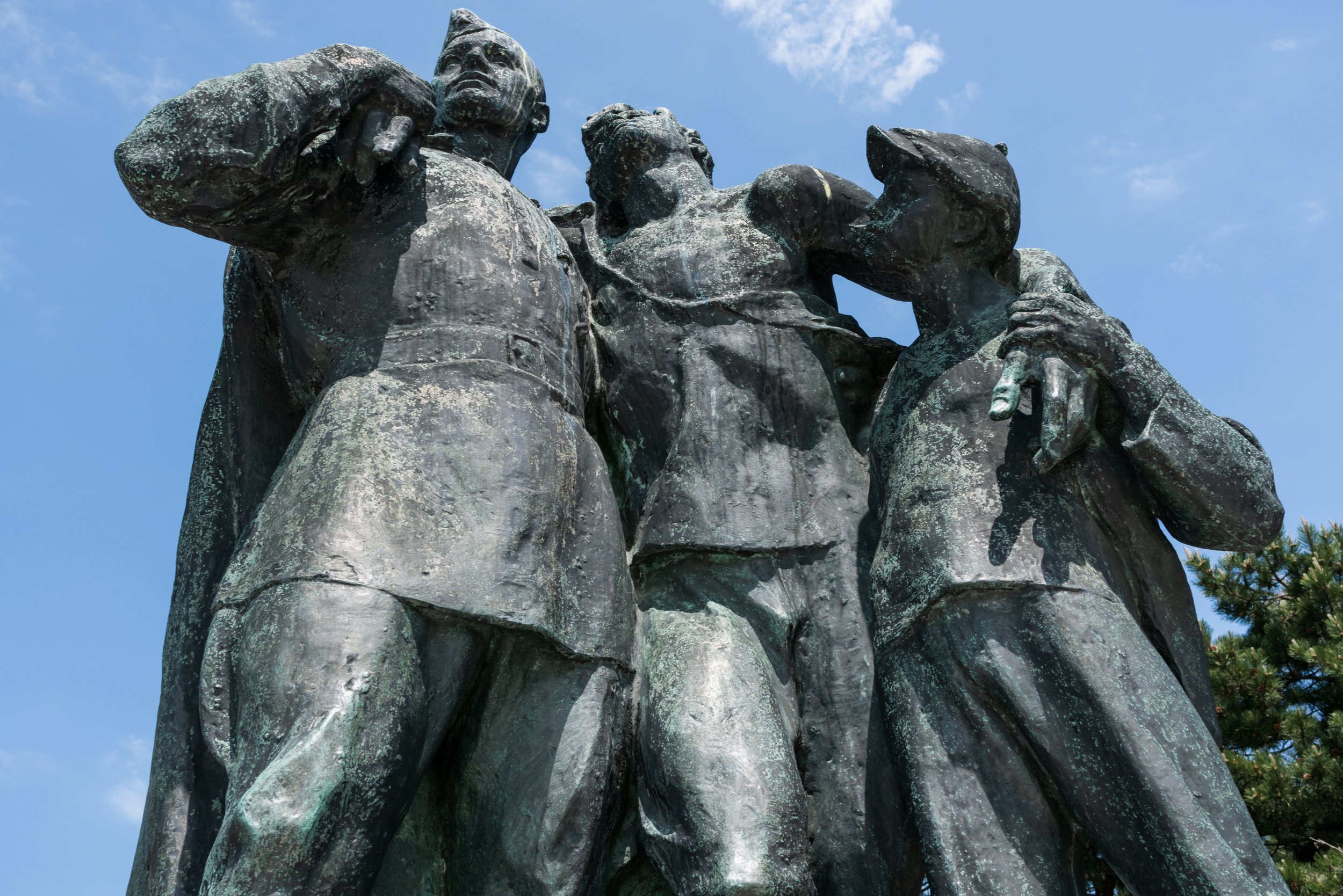 Three men statue at Slavin Memorial