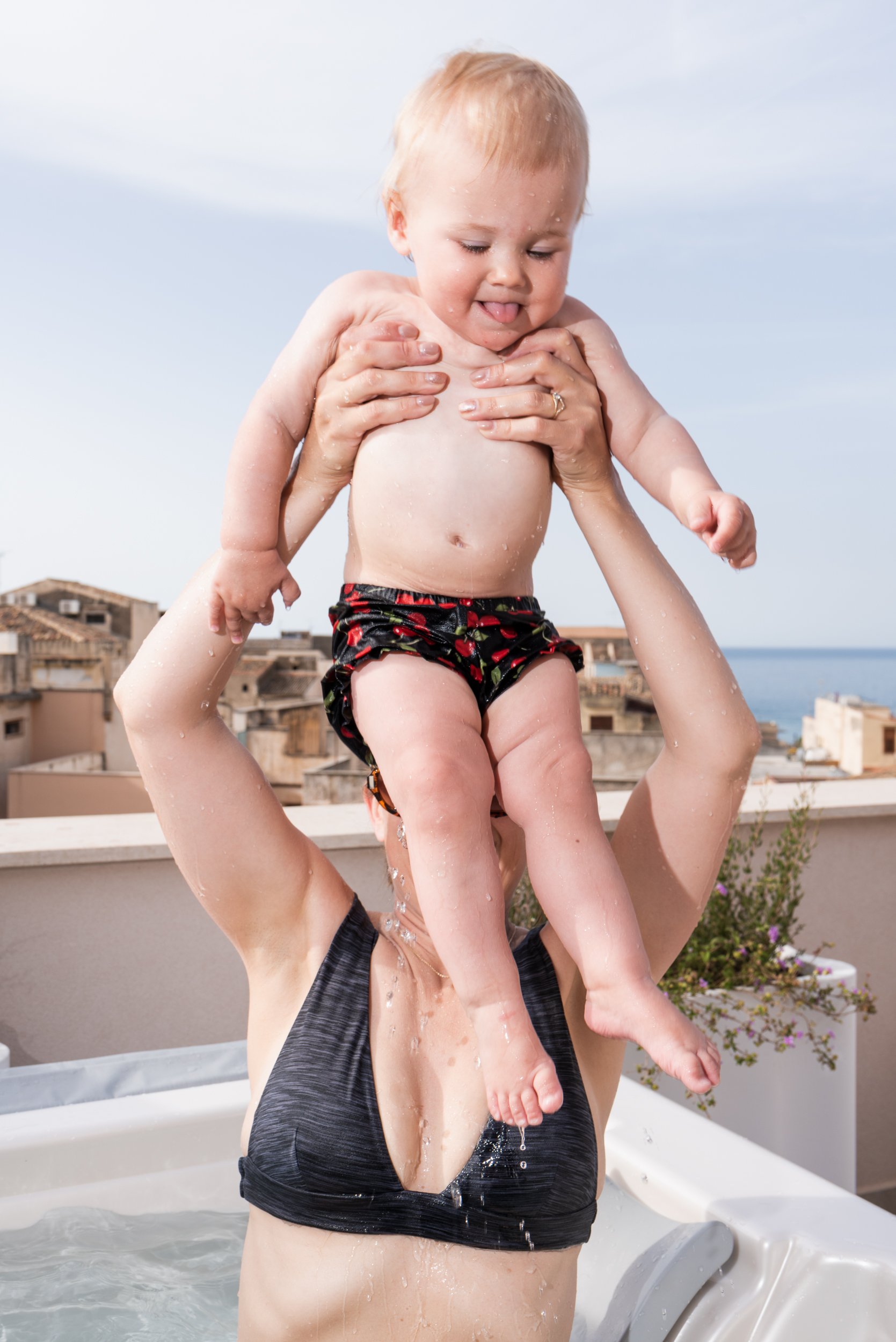 Baby lifted out of hot tub