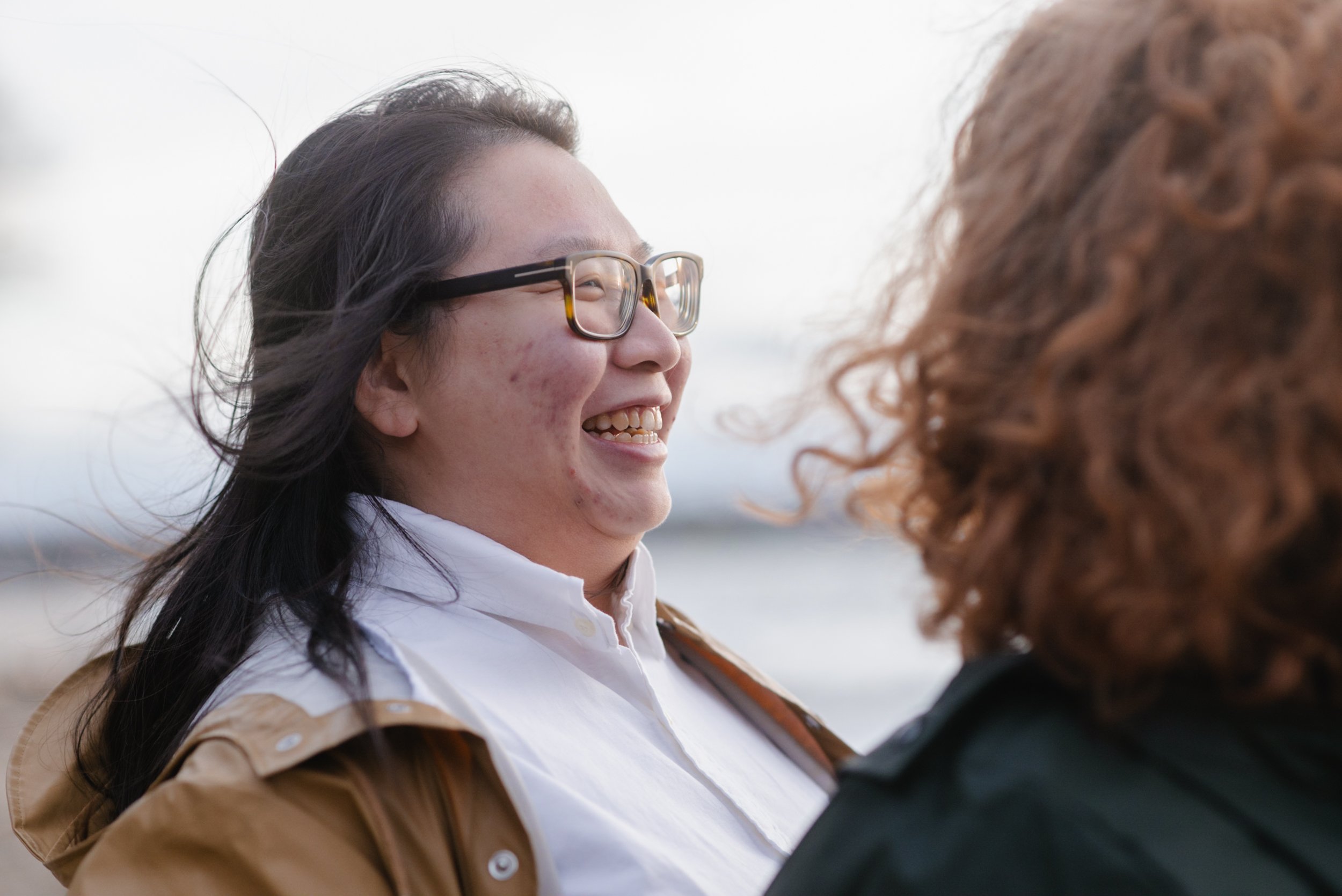 Woman with glasses smiling at partner