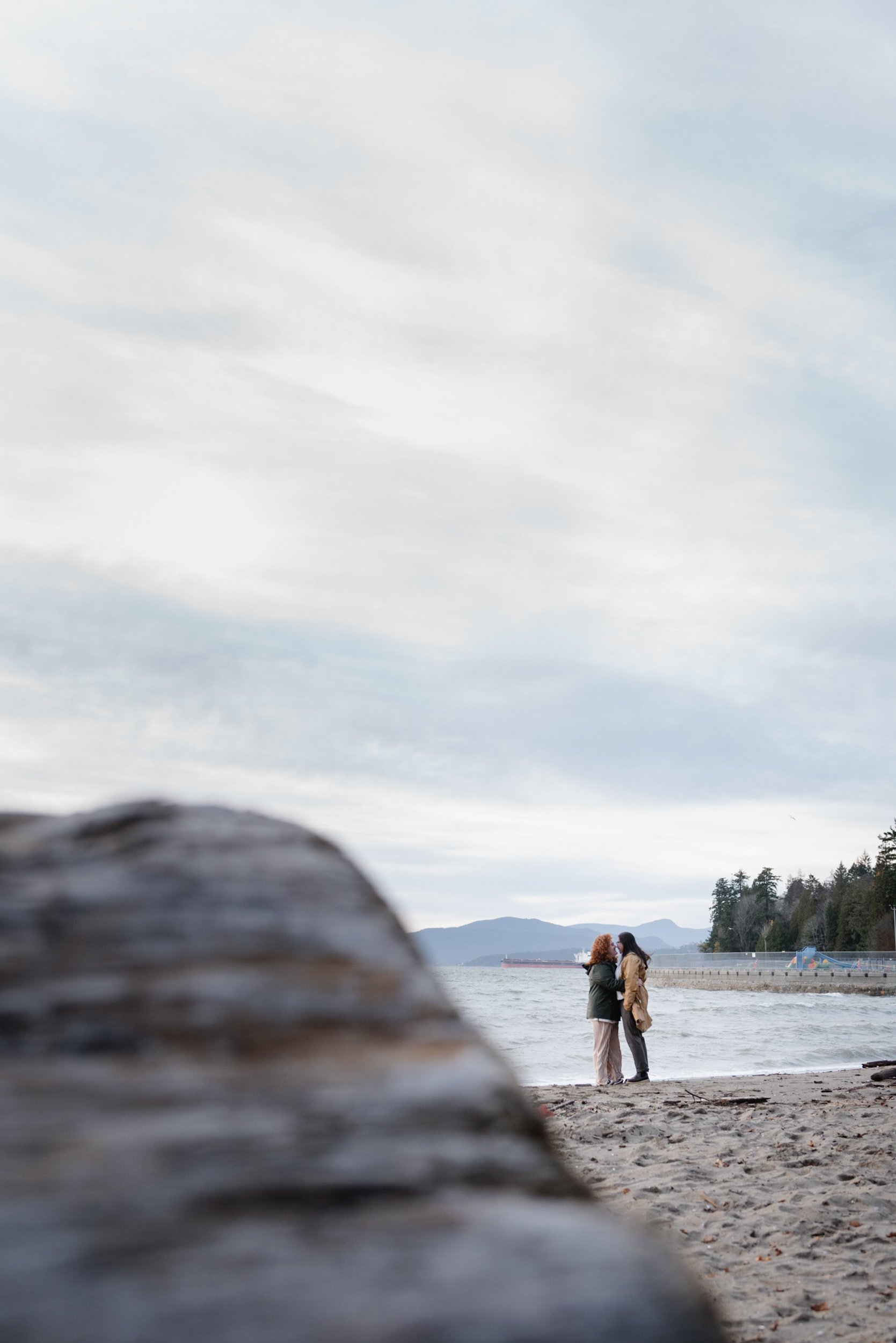 Couple embracing at Stanley Park's Second Beach