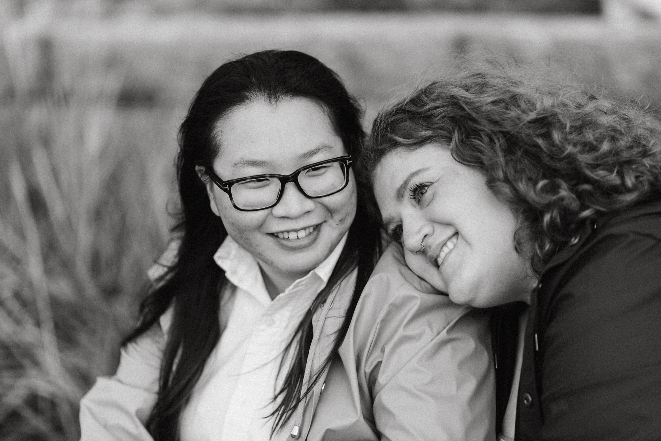 Couple snuggling at Stanley Park's Second Beach