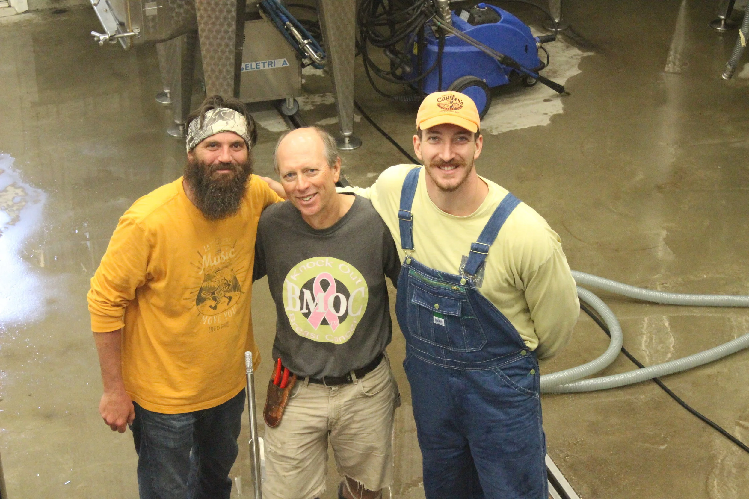 Dodon's new assistant winemaker Seth McCombs (left), Tom (middle), and BJ (right), harvest intern, prepare for bottling. 