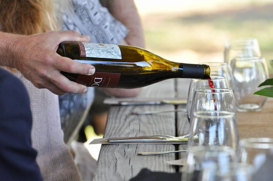 Dodon wine being poured during a private lunch event