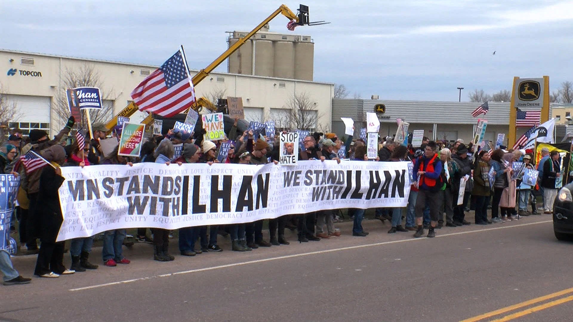 Signs and supporters confront Trump in Burnsville on 4/15/19