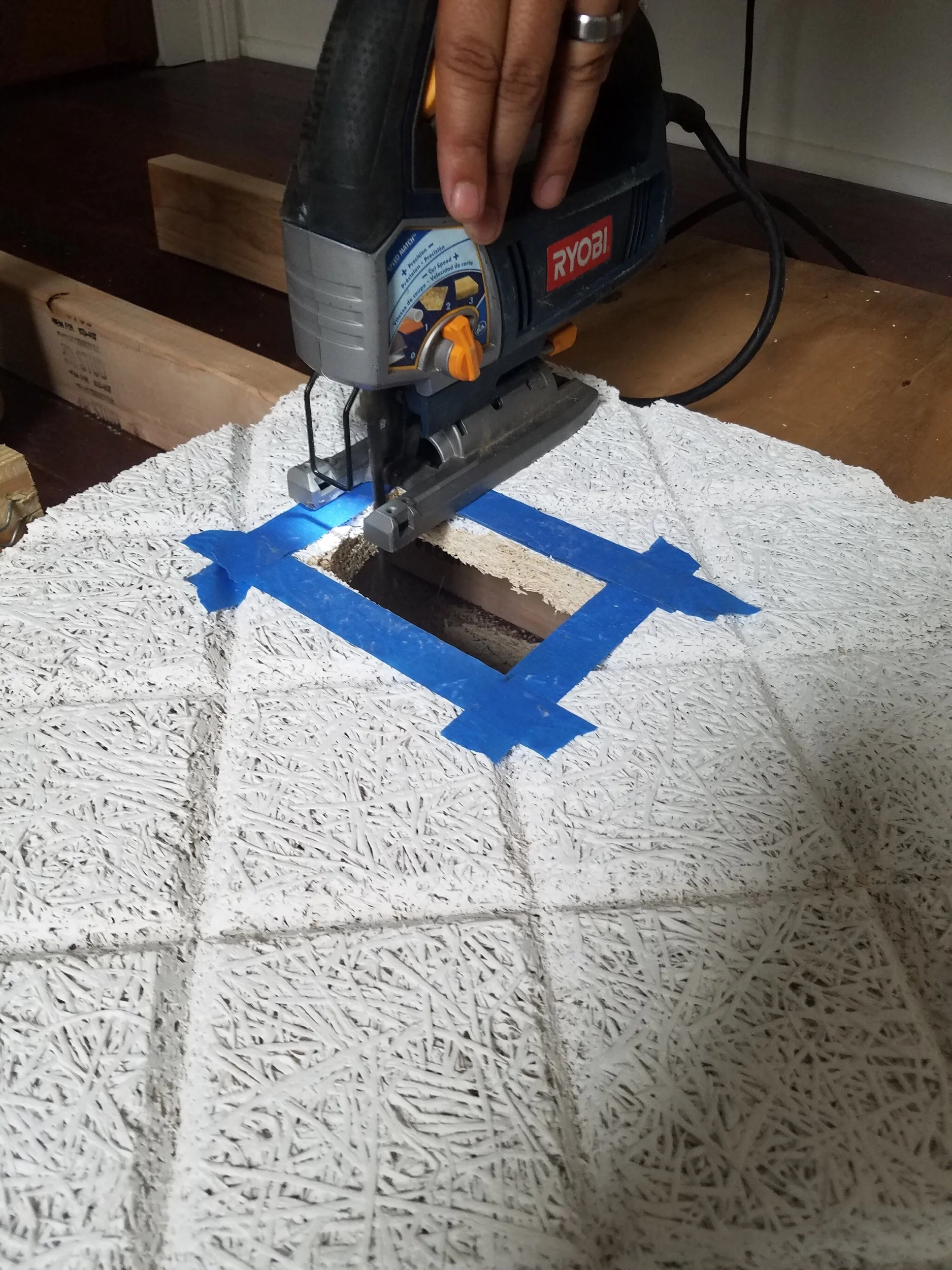 The holes for the outlet were traced and cut out with a jigsaw.