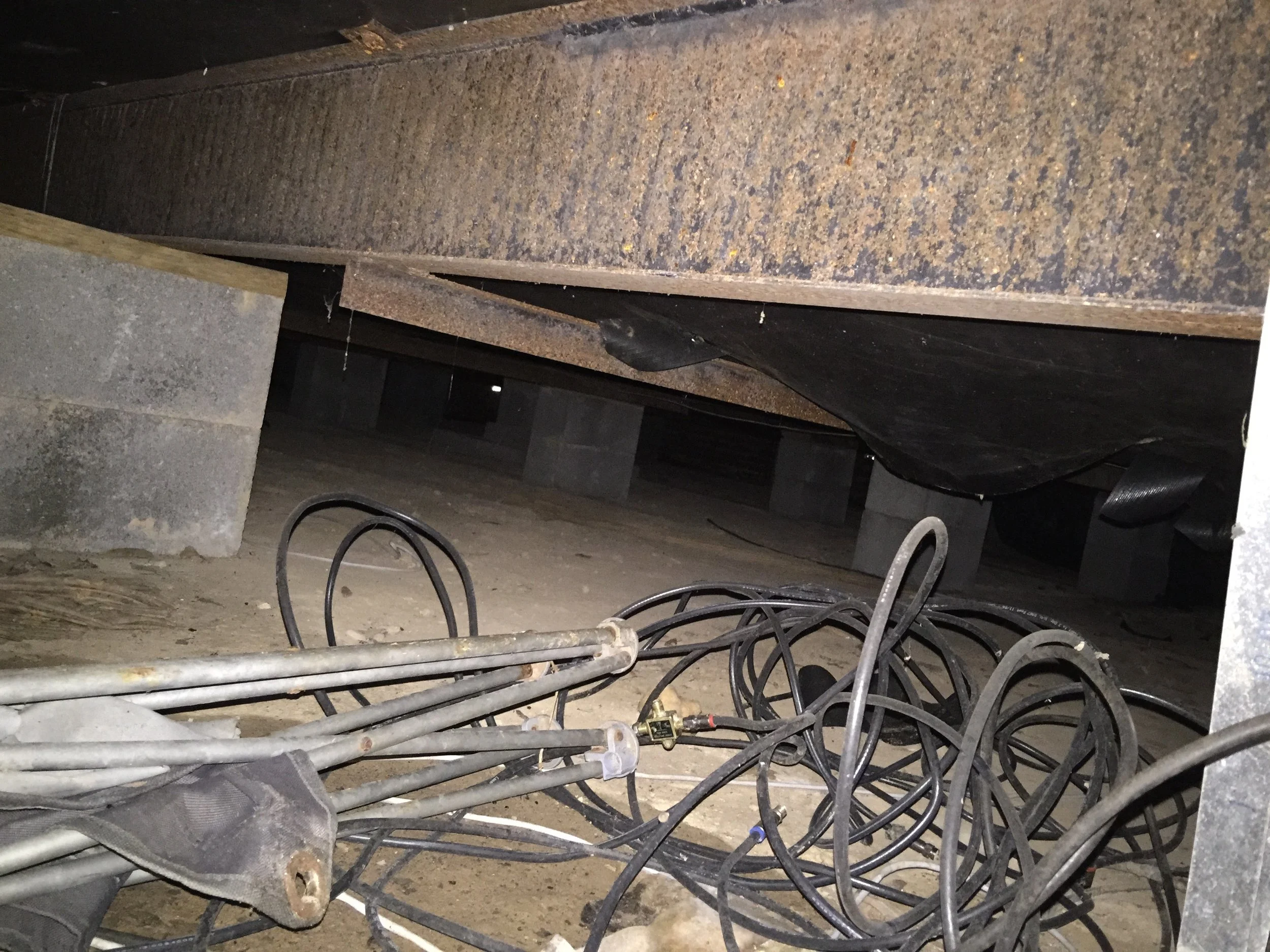 Torn Barrier Under Pier and Beam Foundation