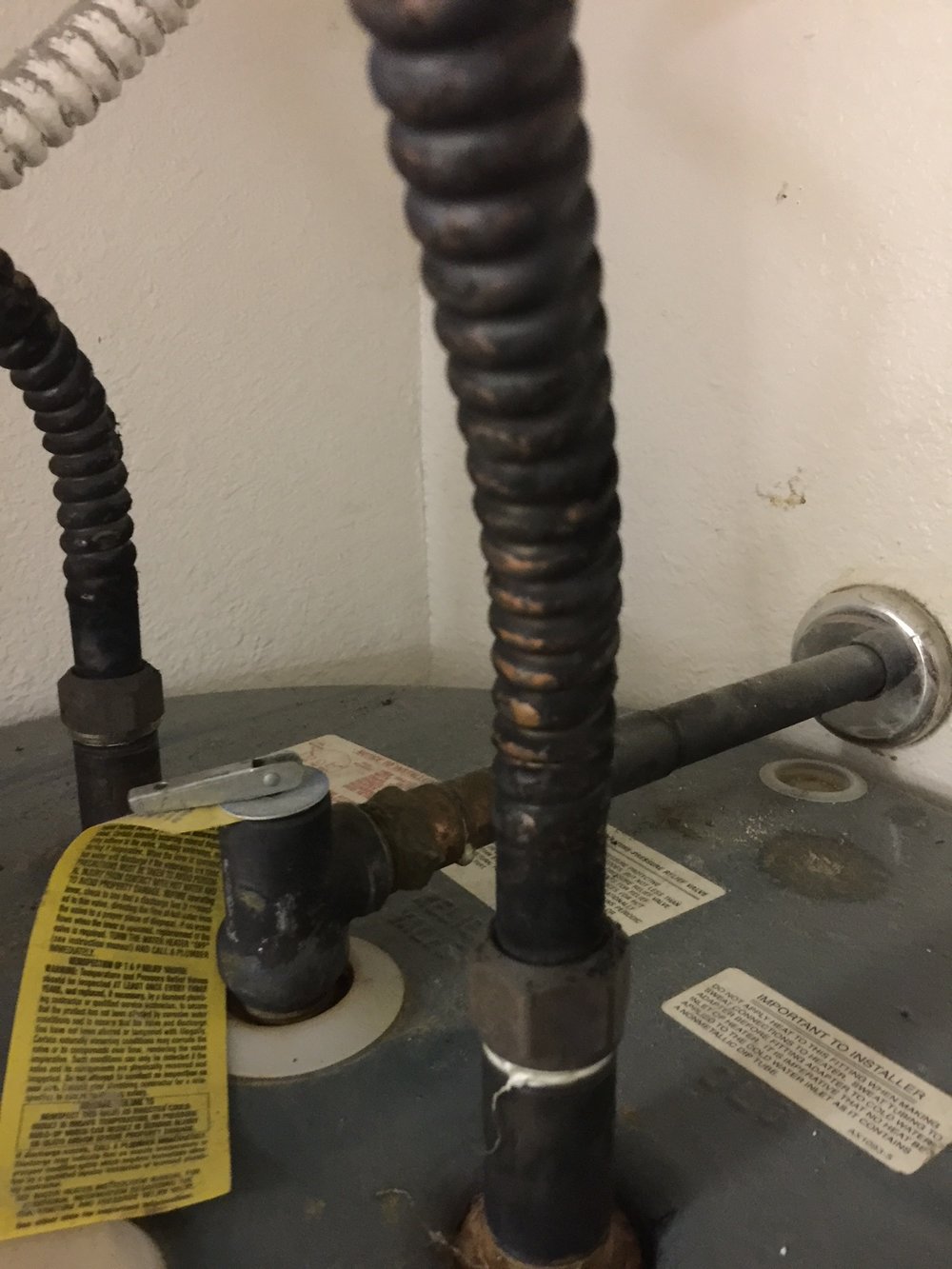 Blackened Hot Water Heater Copper Plumbing Lines Due to Chinese Drywall Found During Home Inspection Houston Texas