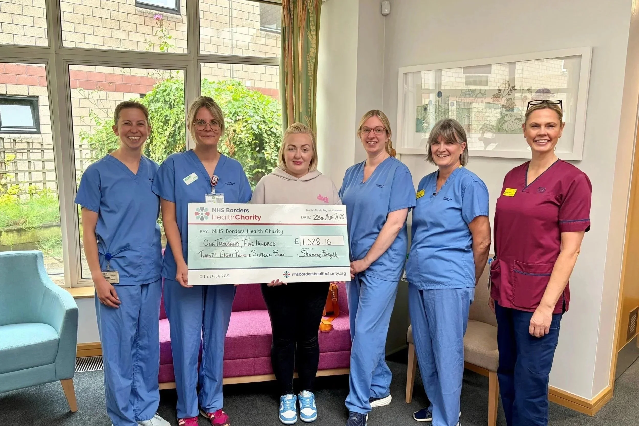 Shannon Conquers Ben Nevis for Border Cancer Services