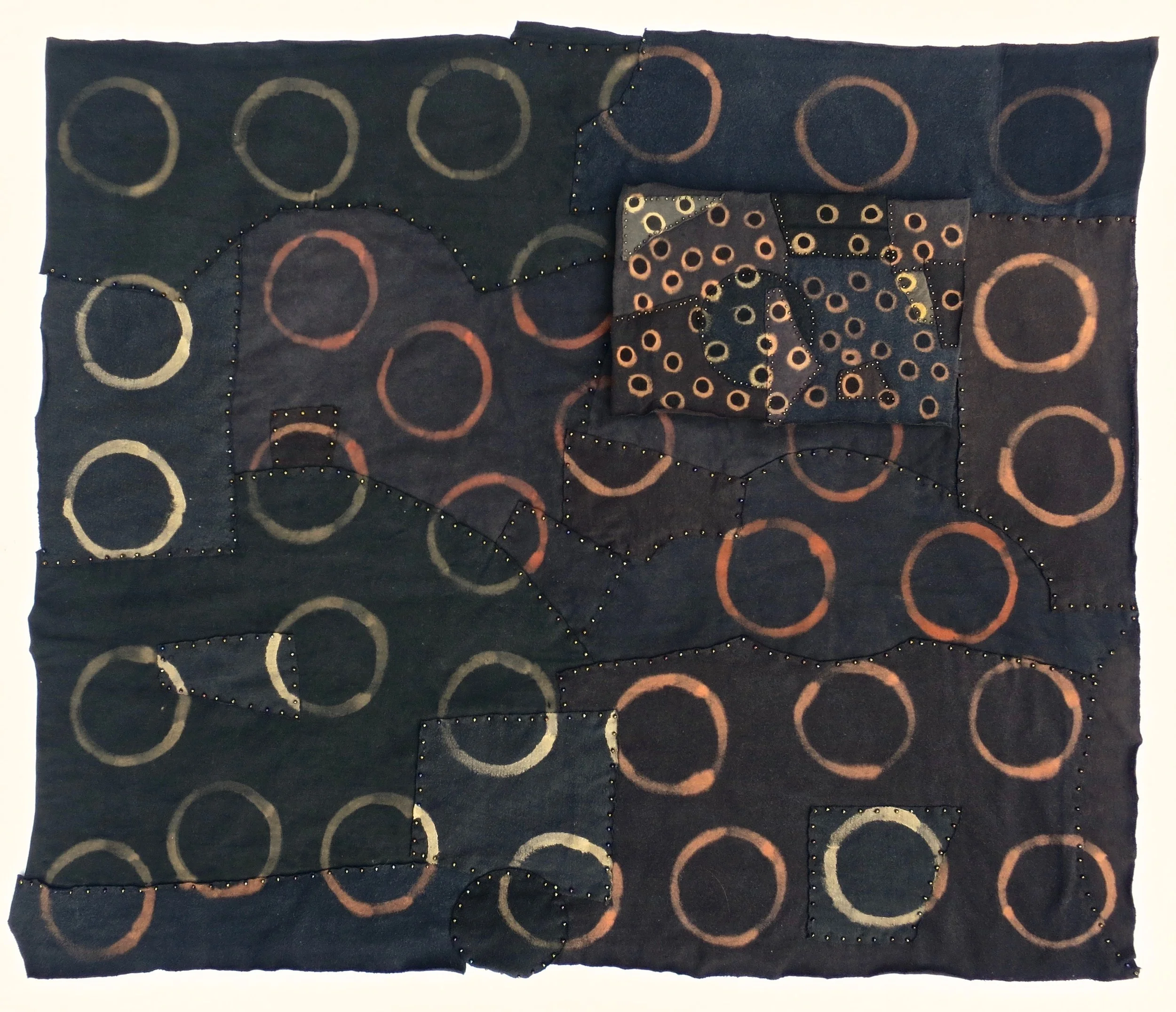 Black T Boro: Rings 2013, approximately 30" x 34". Repurposed cotton t-shirts and beads collaged and hand sewn, color manipulated. 