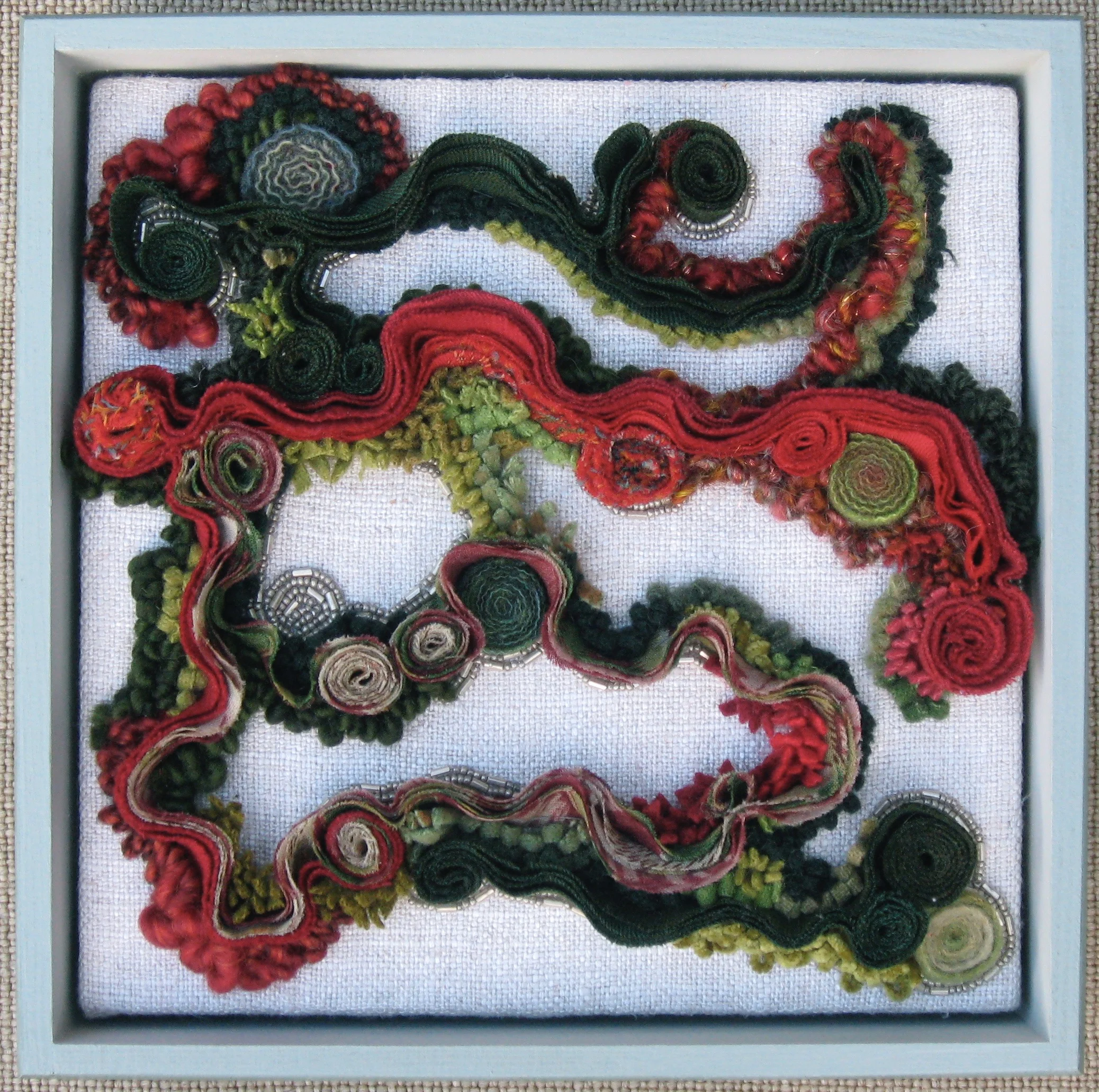 Wandering 2011 9" x 9" x 3" Wool, antique paisley shawl, glass beads hand sewn, hand hooked, bias shirred and coiled.