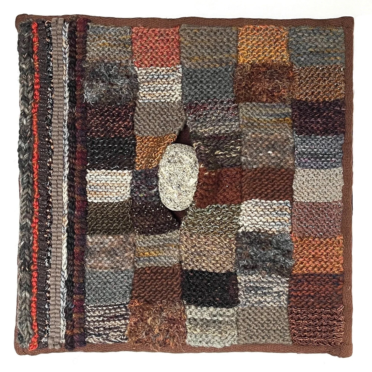 #28 Rock Square
One rock. Knit, hand hooked, chain stitched, hand sewn using wool, novelty and wool yarn, glue, cotton twill binding tape.
This and #29 are made from various knit squares I made to see how various yarns looked when combined with other