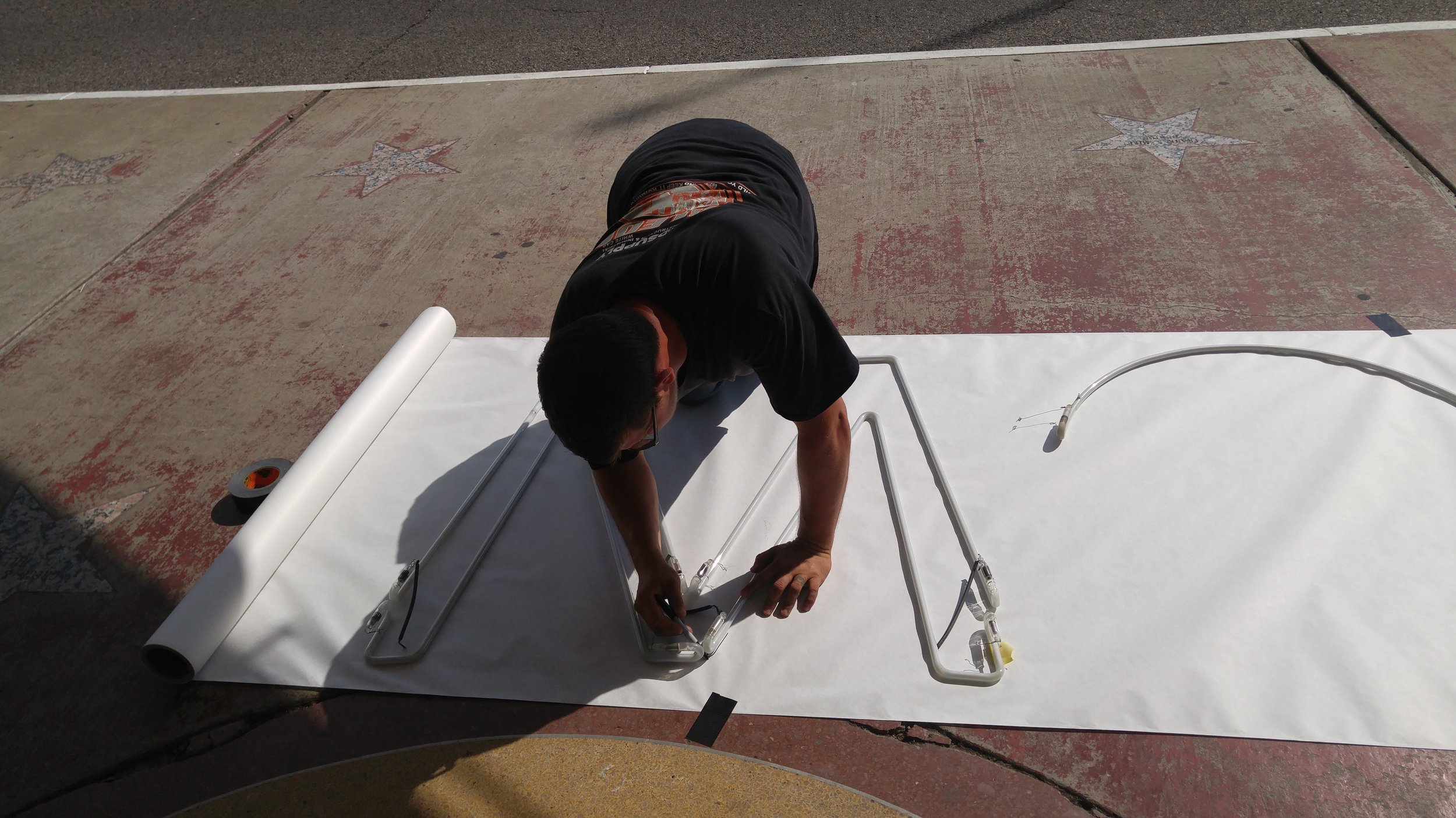 Original neon taken down and a template is traced.