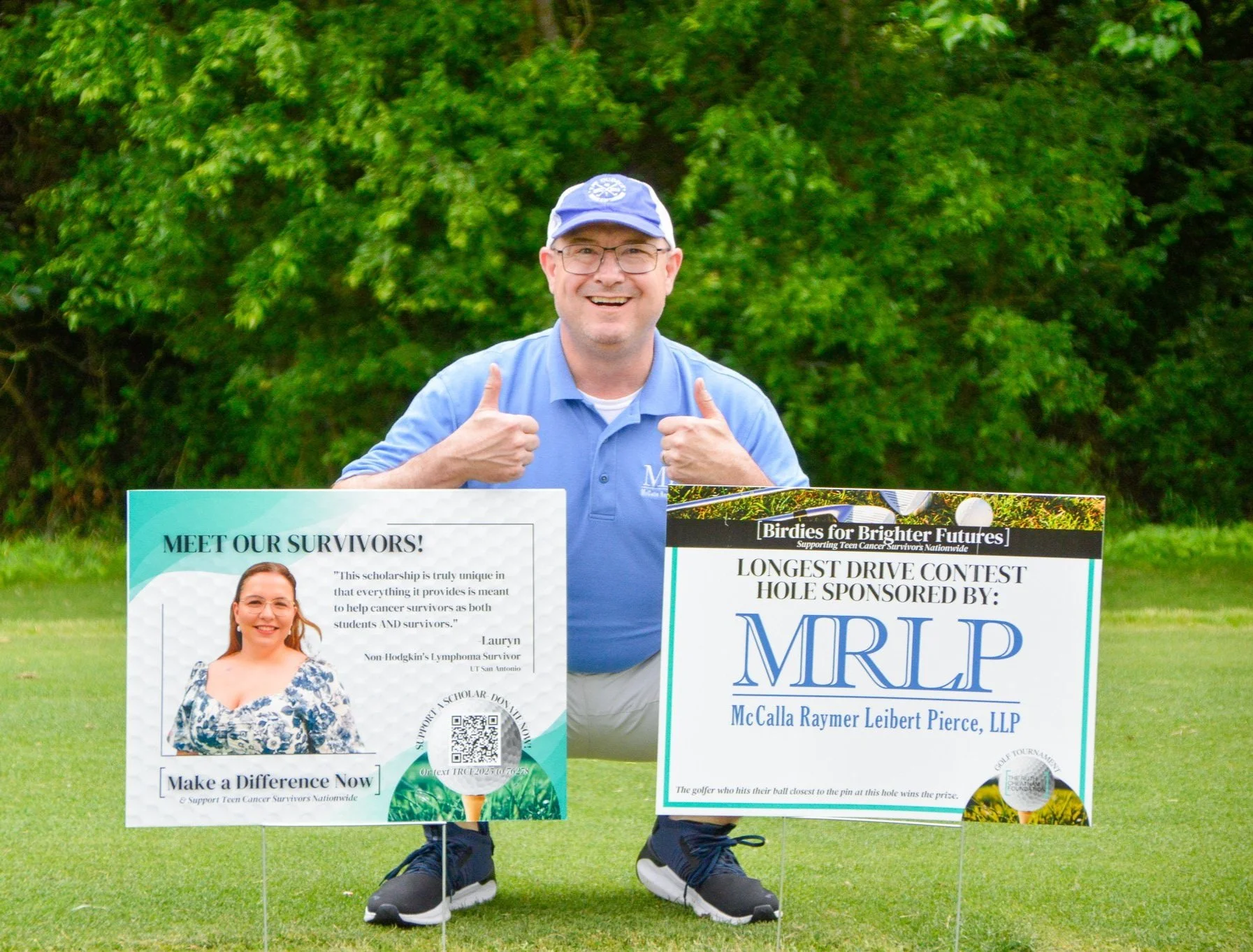 A man smiling and giving two thumbs up, kneeling on a golf course grass next to two large sponsorship signs. The signs support cancer survivors and advertise a longest drive contest sponsored by MRL LP, with a background of green trees.