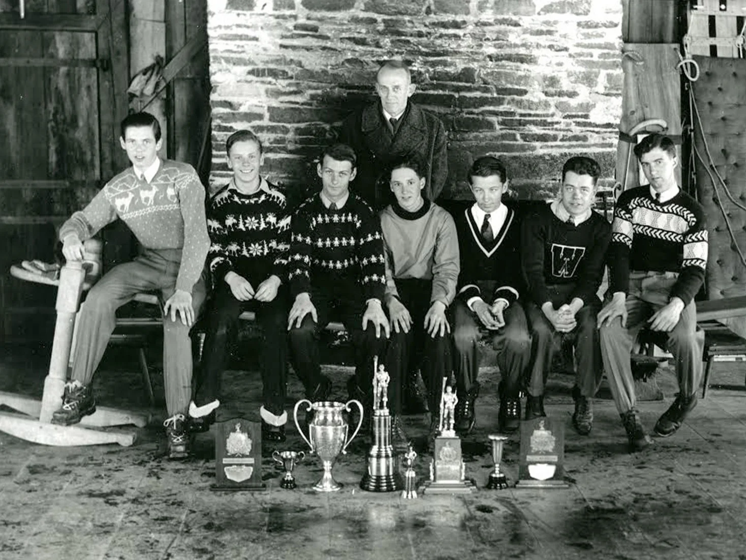 1942 Vermont Champions, taken in Gully Lodge. Back row: Coach Richard Marble Front row, left to right: Toni McManama, Bud Schoenfeld, Harry Ambrose, Harry Putney, Larry Ambrose, Vernon Cram, Bob Green.