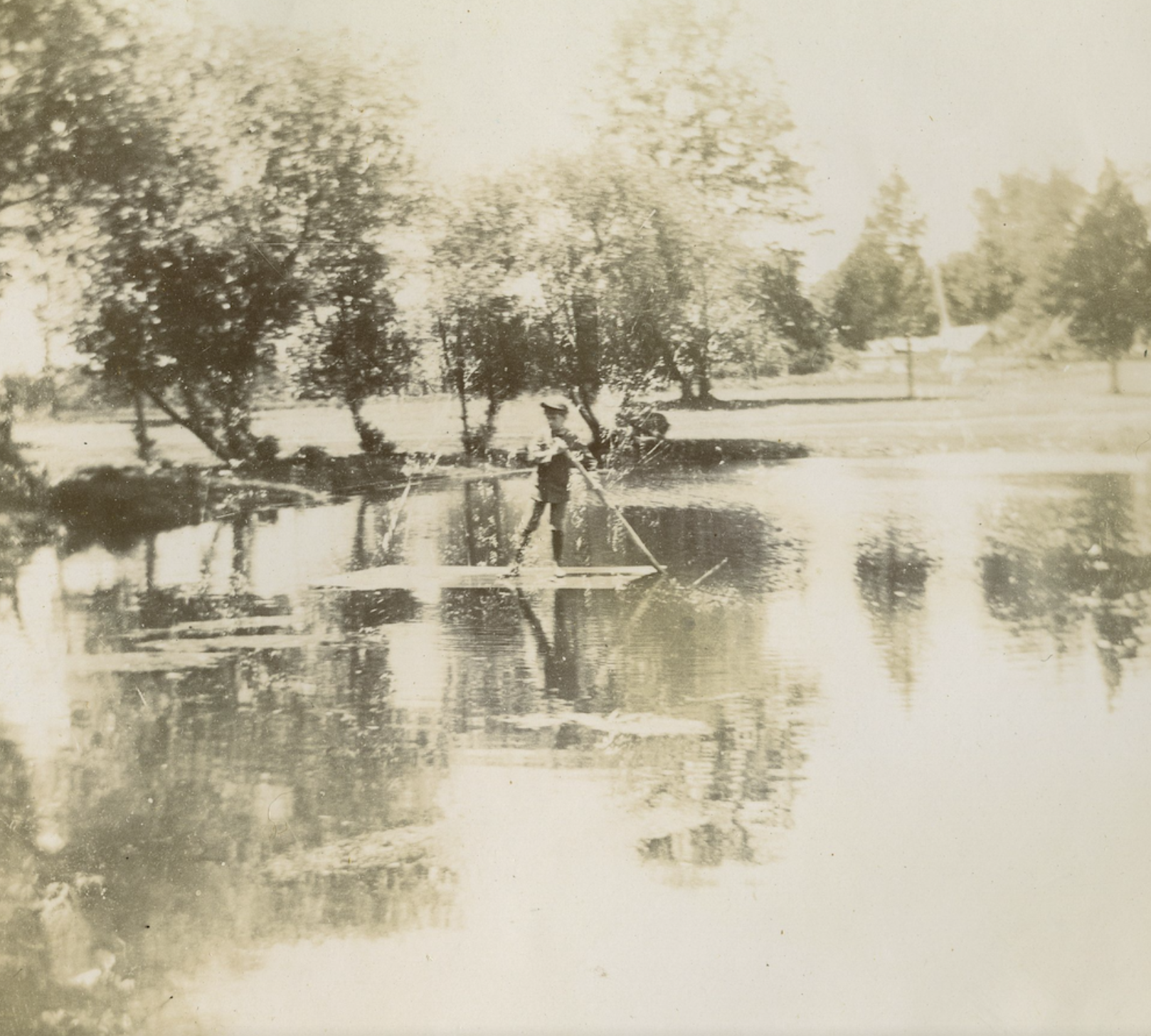Boy Rafting on a Pond at Hill Top Farm