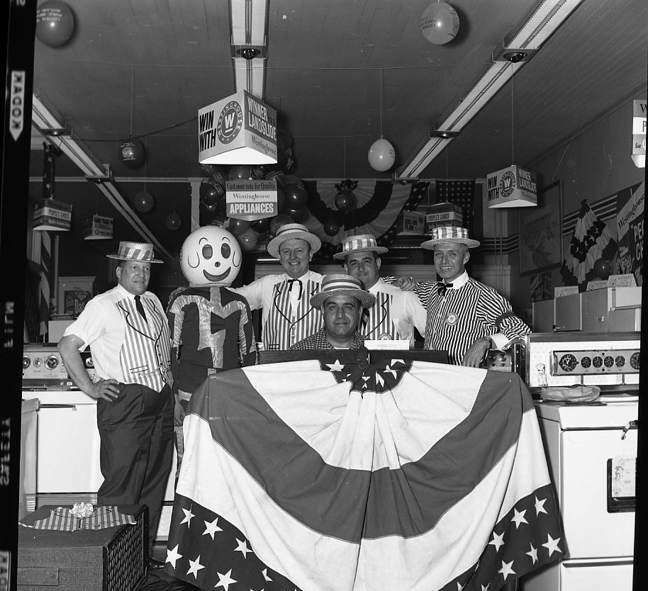 Staff at the CVPS office with mascot Reddy Kilowatt