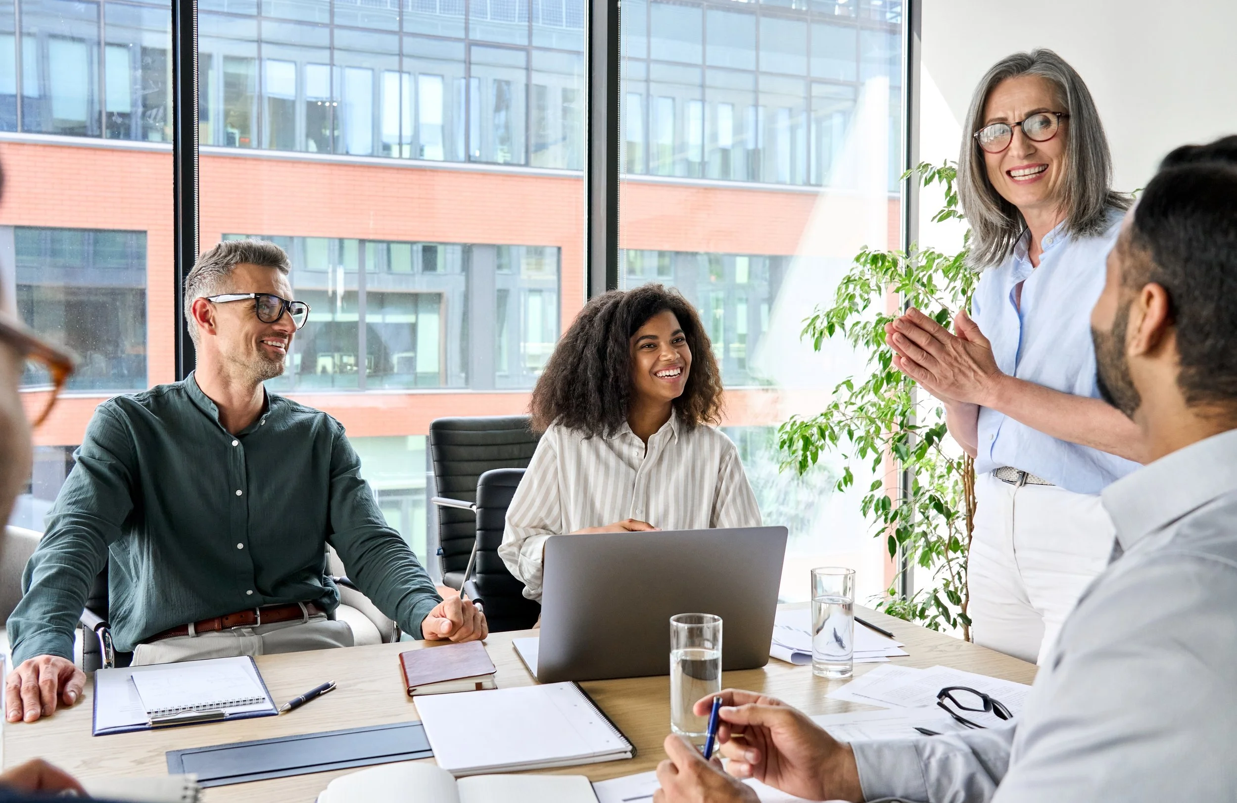 happy-diverse-corporate-team-discussing-project-in-2021-09-04-09-42-11-utc.jpg