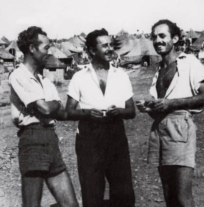 Ritsos (center) at Makronisos. 