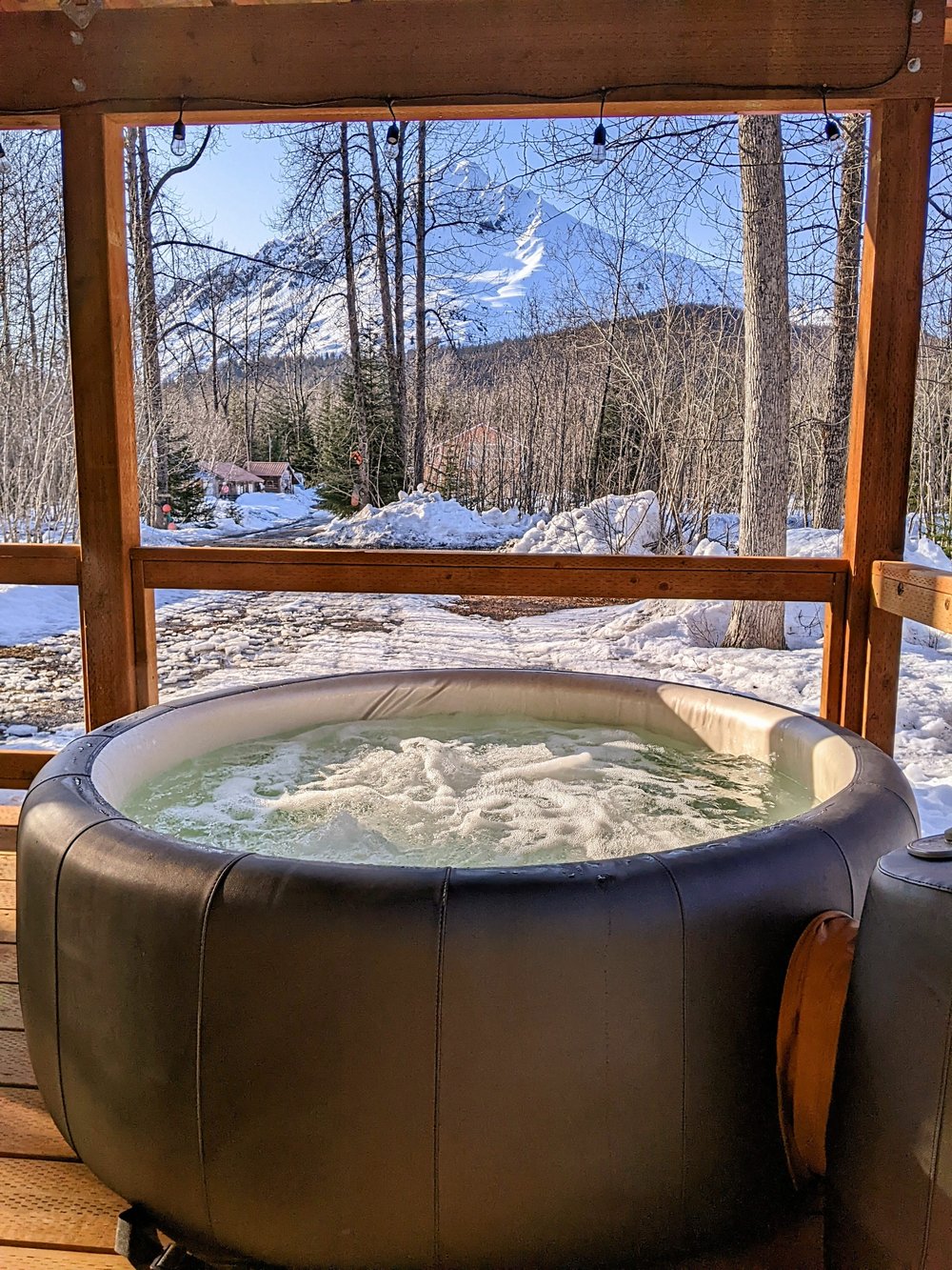 Hot tub with a view! Resurrection Peak shows off in the background.