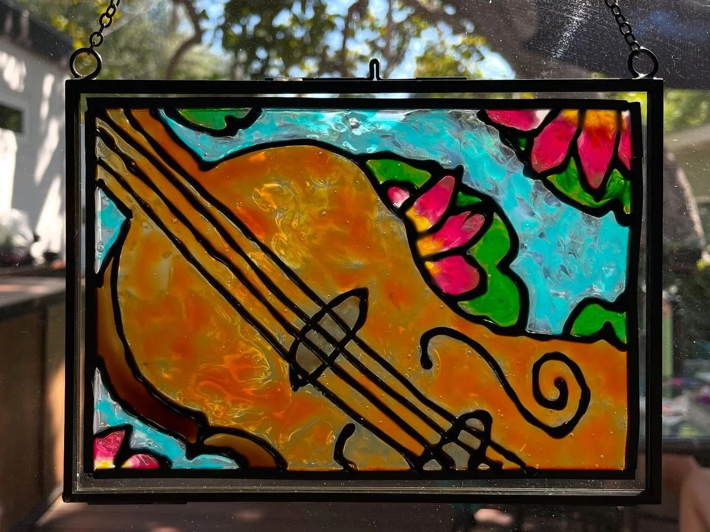 Faux stained glass magic, from pencil drawing to finished sun catcher 🌈💖

Squirtle the (red eared slider) turtle and a floating violin surrounded by lily pads 

So proud of how these turned out!