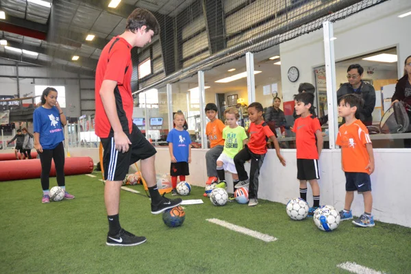 Coach Shows Students Soccer Drill
