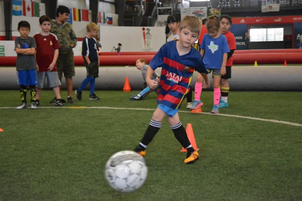 Boy Practices Soccer Shooting