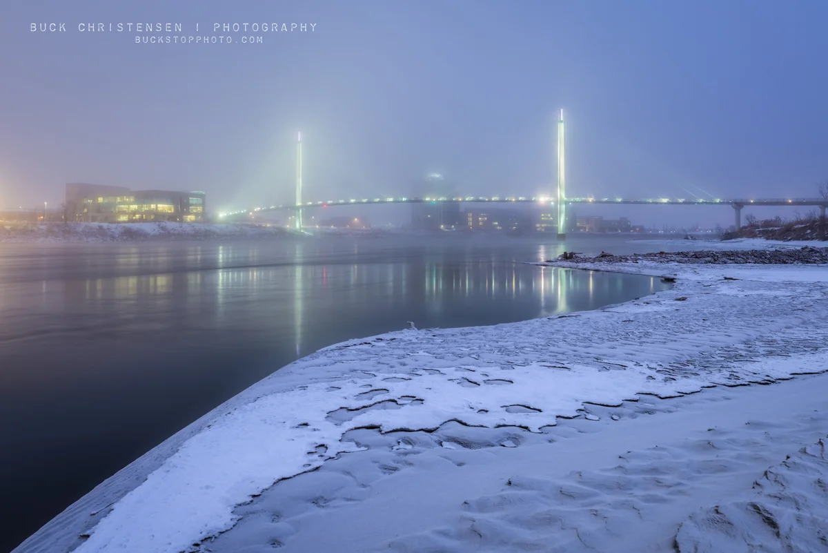 bob kerrey pedestrian bridge in the winter fog as viewed from council bluffs, iowa, omaha, nebraska