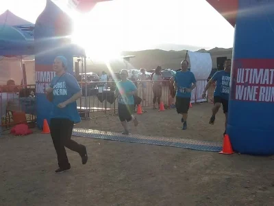 Marisa crossing the finish line.