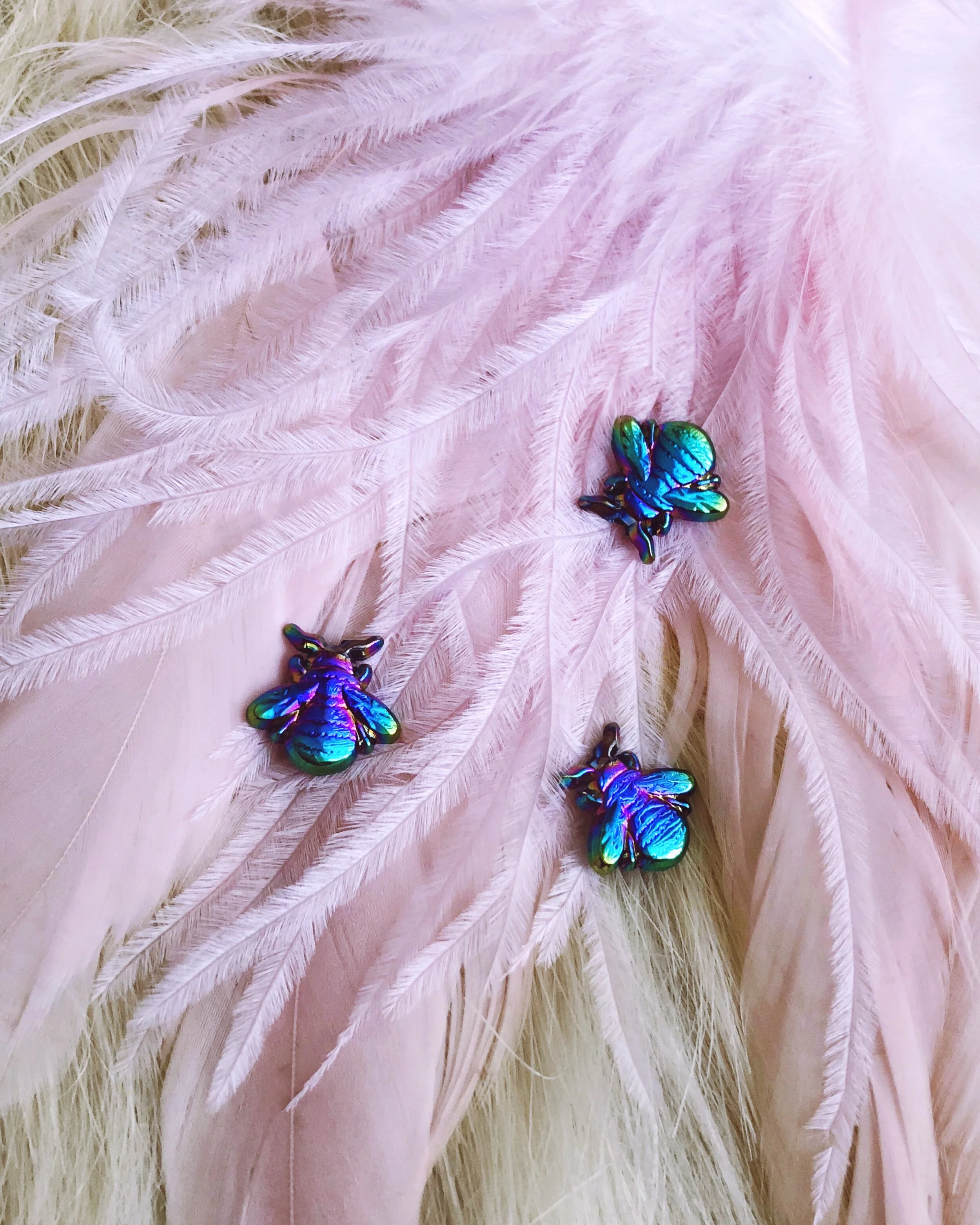 the rainbow bee 3d anodized metal animal nature pin designed by lilly baik.