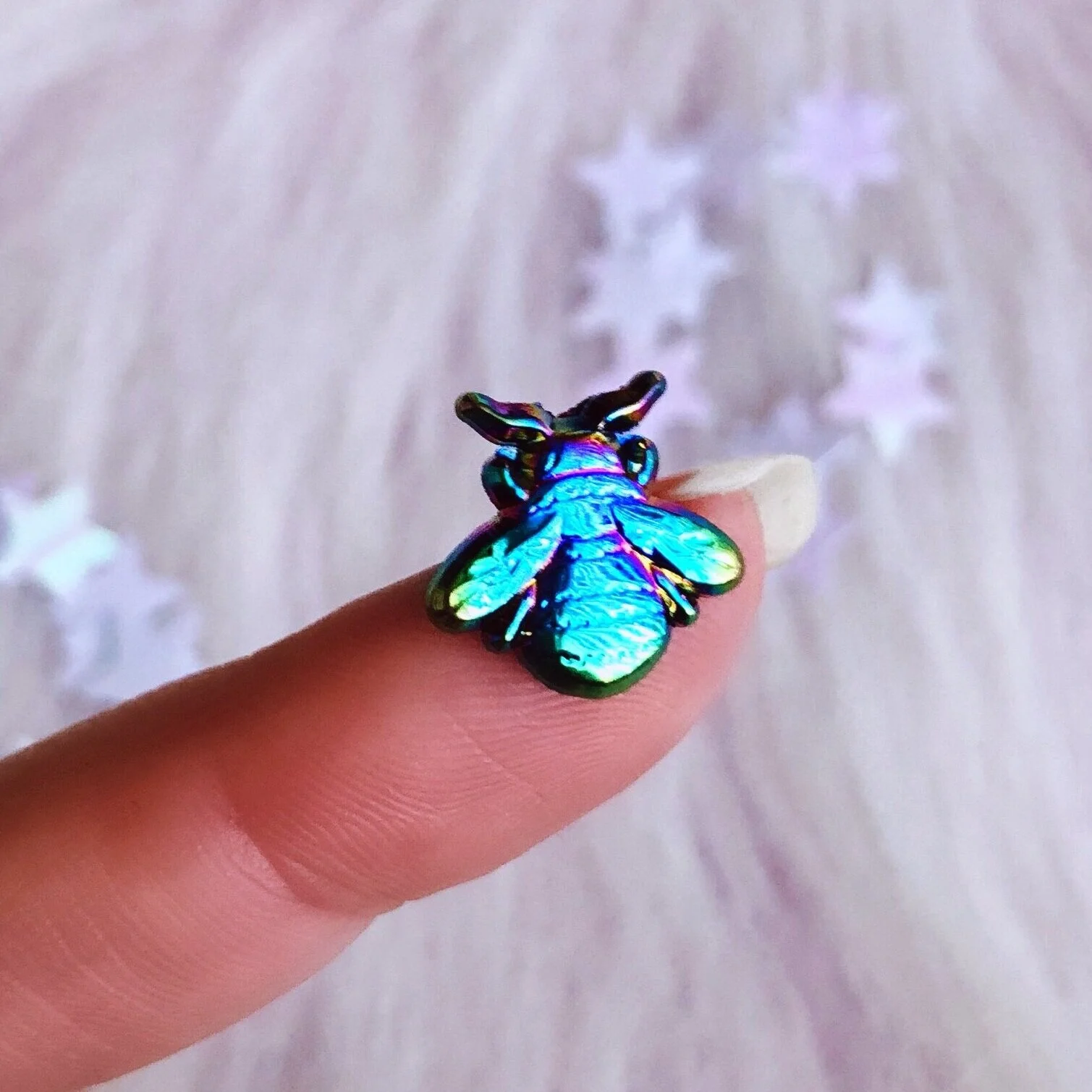 the rainbow bee 3d anodized metal animal nature pin designed by lilly baik.