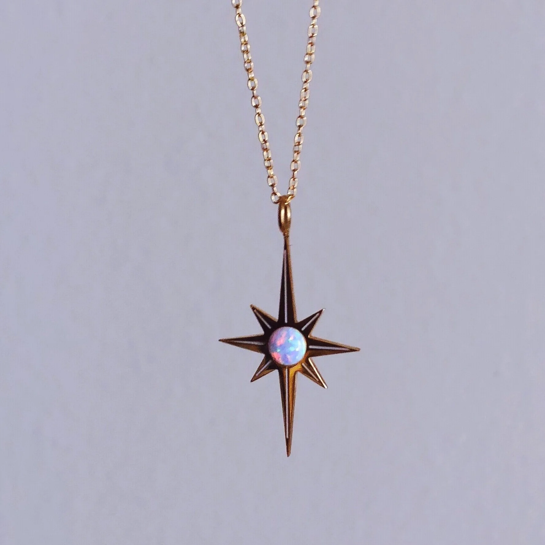starburst opal necklace in mystic white, delicate dainty gold pretty star necklace designed by lilly baik.
